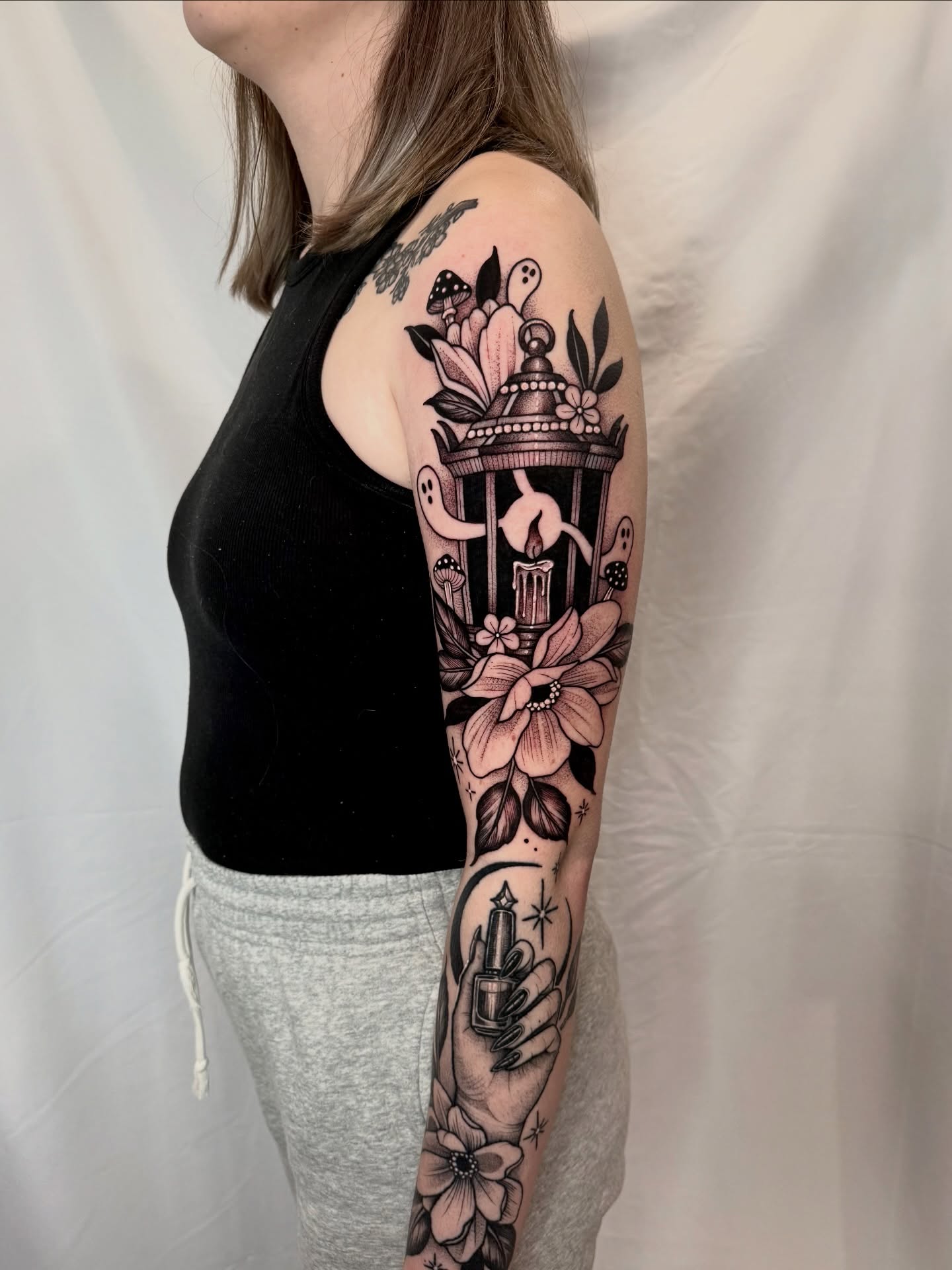 Caged figure with flowers black and grey tattoo on the forearm by ⚡️ Krissy Fabis ⚡️