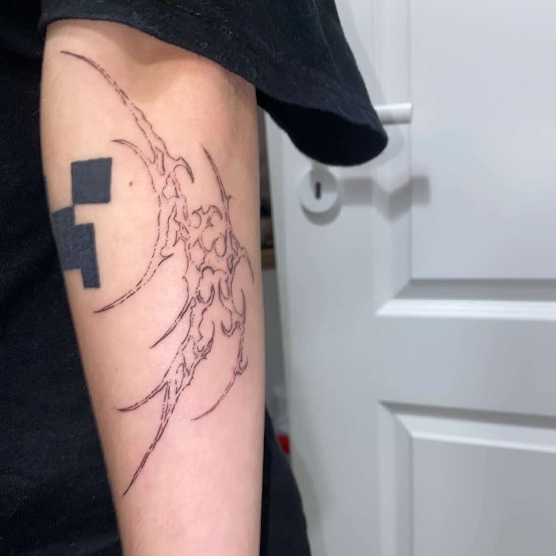 Flame black and grey tattoo on the forearm by kacper