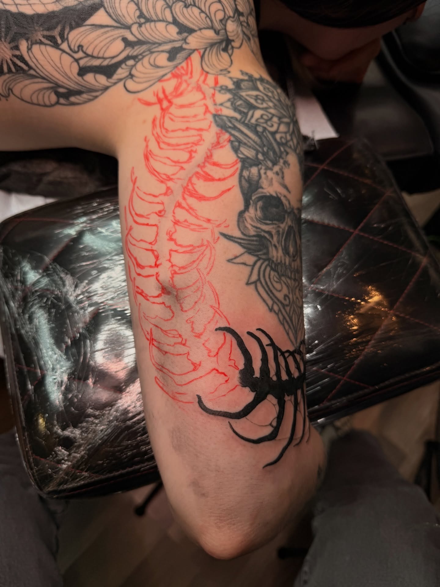 Spine black and grey tattoo on the forearm by Carrie