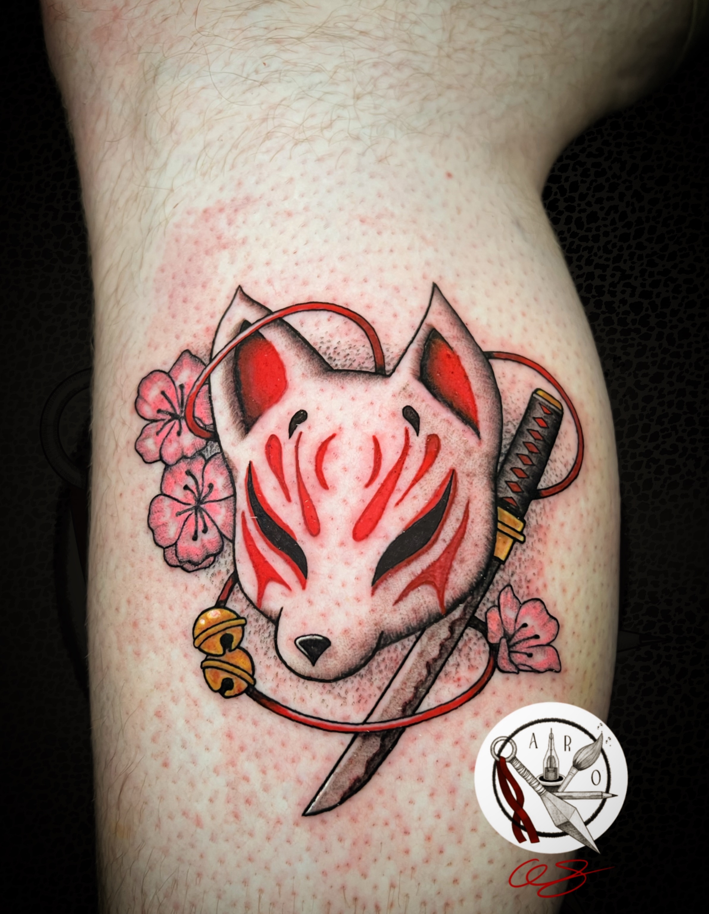 Kitsune mask American traditional tattoo on the thigh by Aaron Strobehn