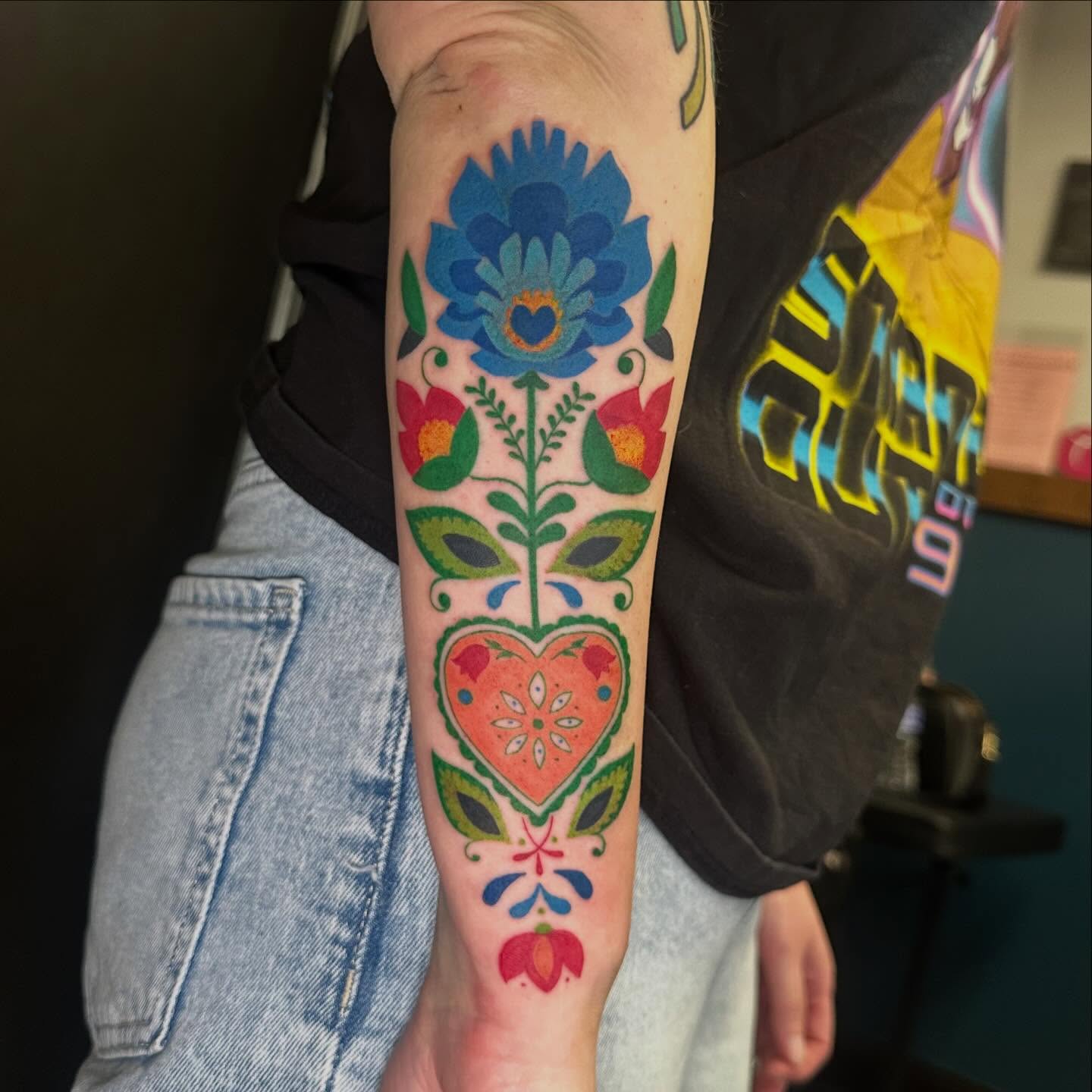 Floral arrangement with heart ornamental tattoo on the forearm by Victoria Parsons, Clarksville, Indiana