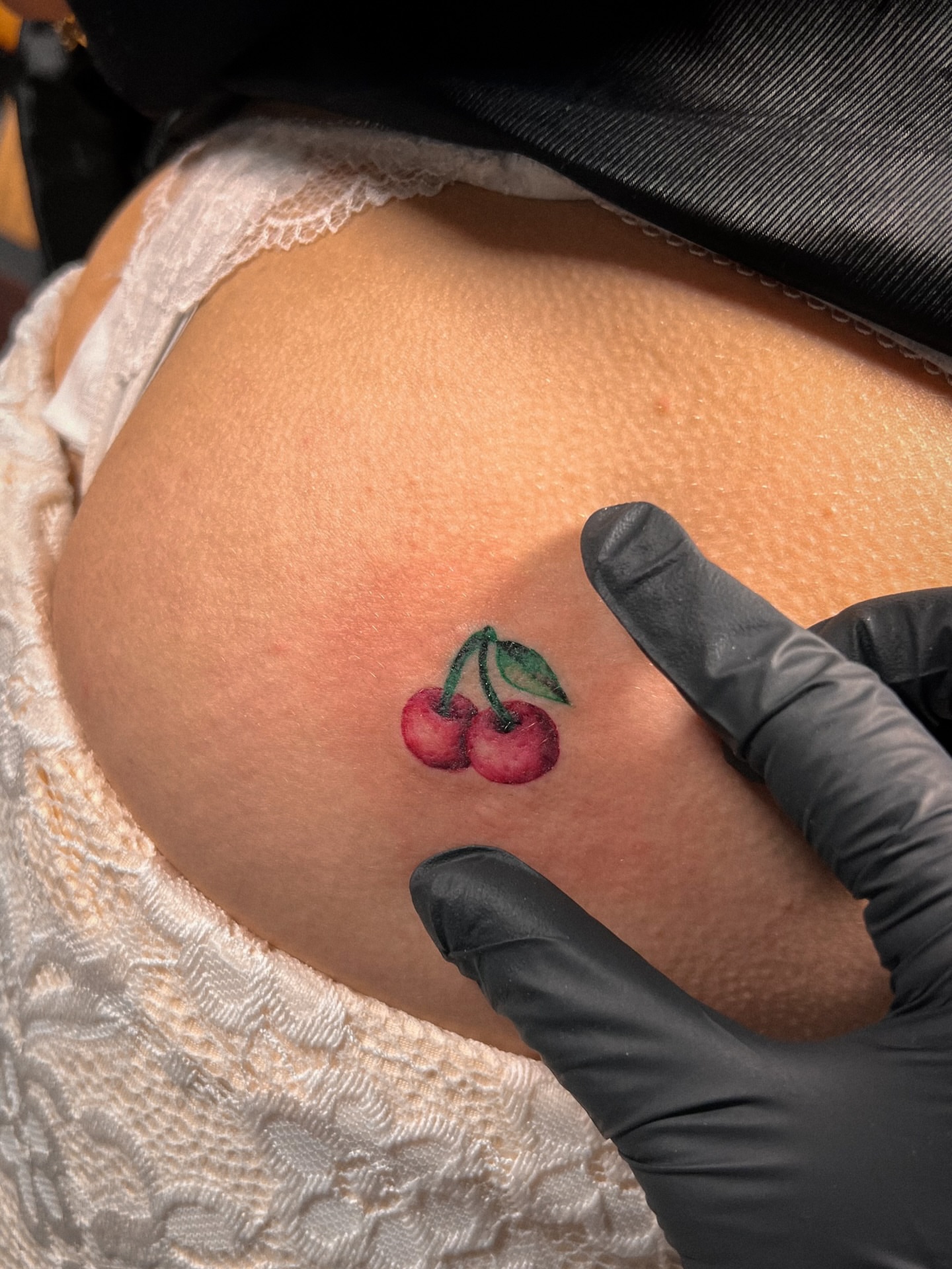 Cherries realism tattoo on the torso by Asap tattoo