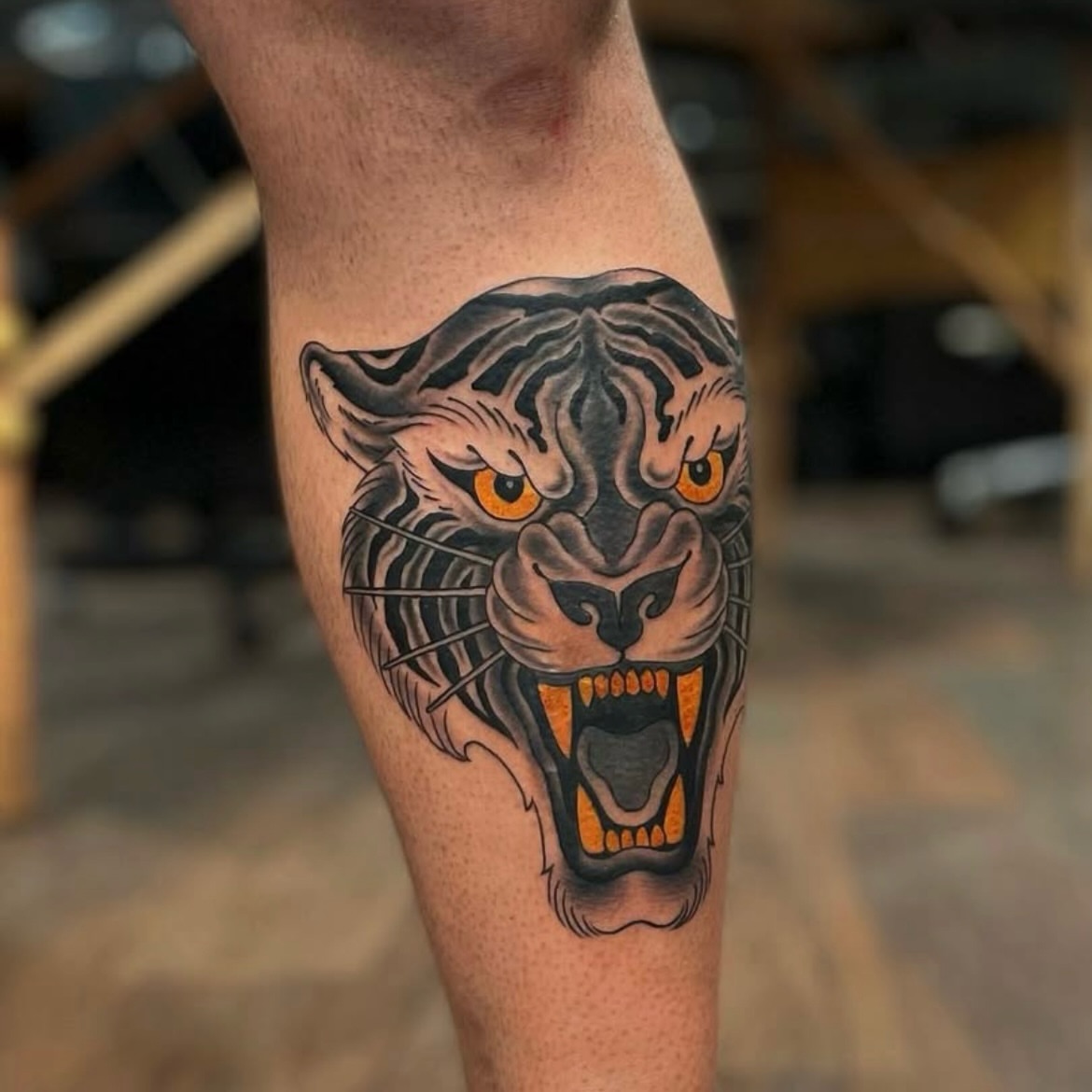 Roaring tiger American traditional tattoo on the forearm by Ｊｉｍ Ｓｙｌｖｉａ