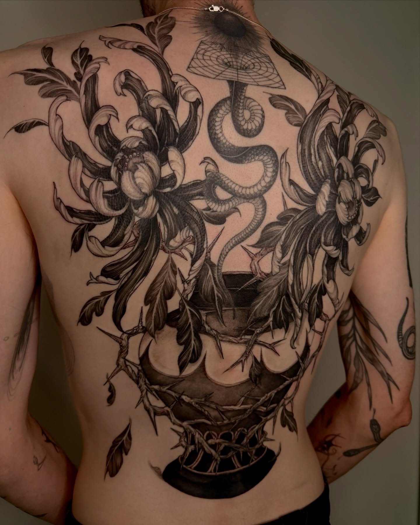 Snake and peony realism tattoo on the back by Sab
