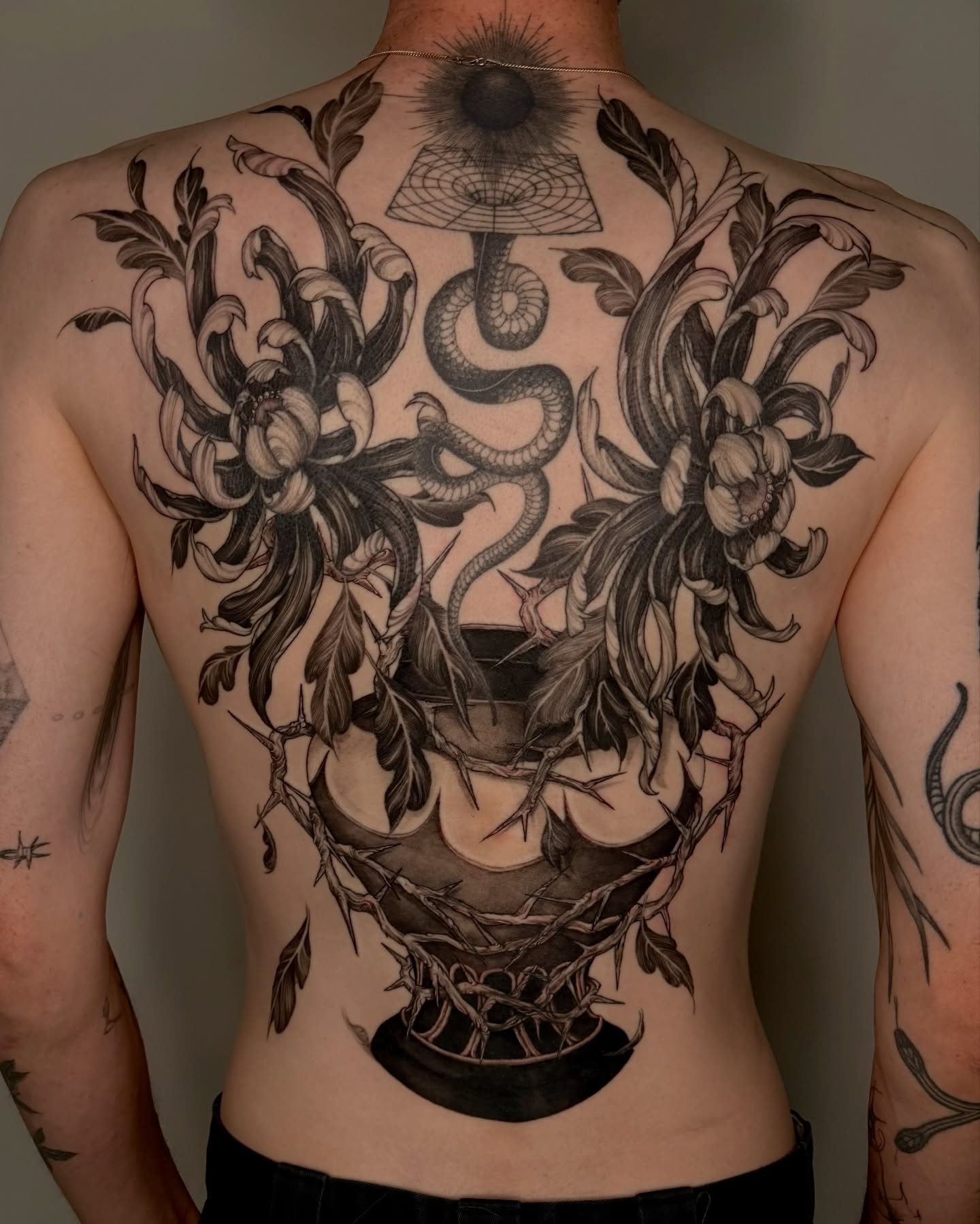 Snake and peony black and grey tattoo on the back by Sab