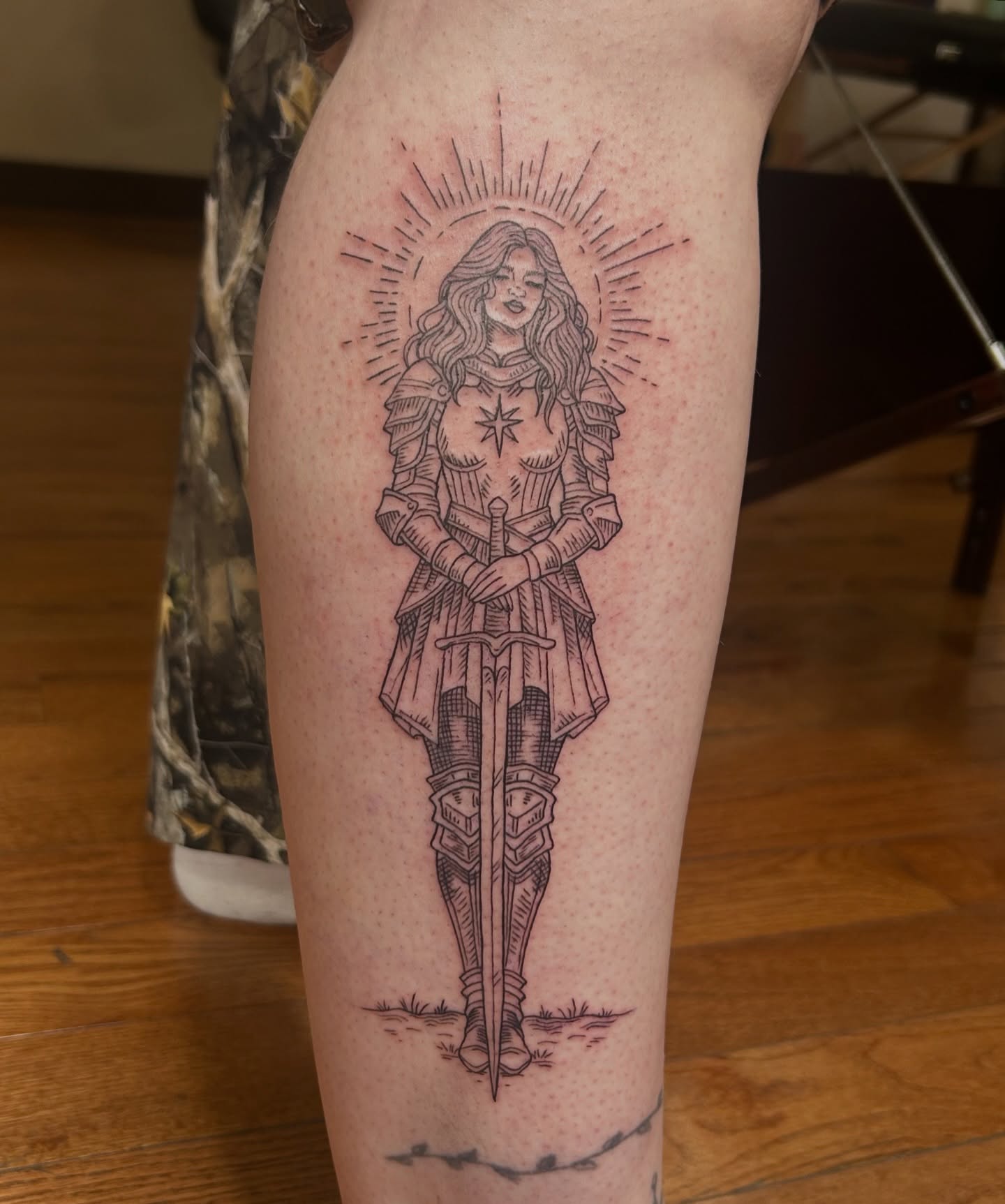 Female warrior black and grey tattoo on the thigh by Kaylee