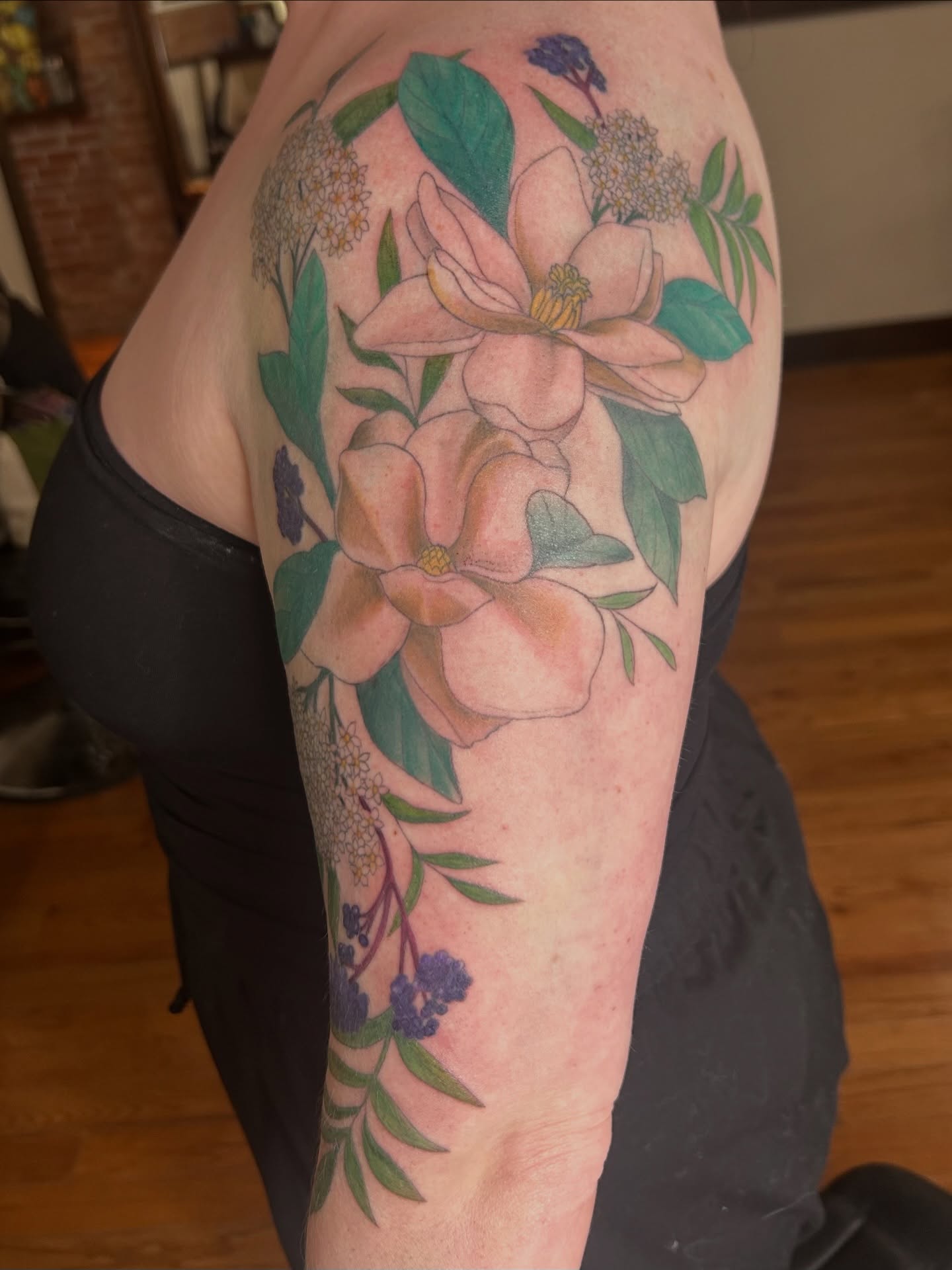 Flower bouquet realism tattoo on the forearm by Kaylee