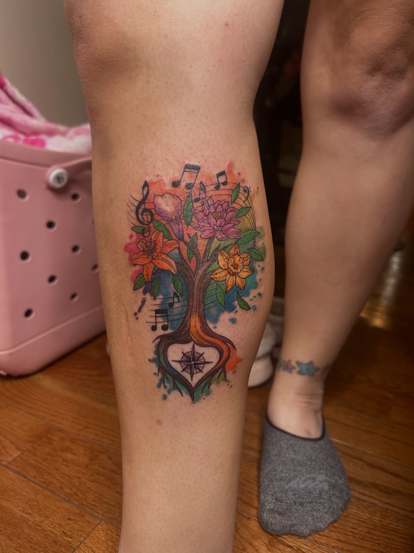 Music tree watercolor tattoo on the calf by Kaylee