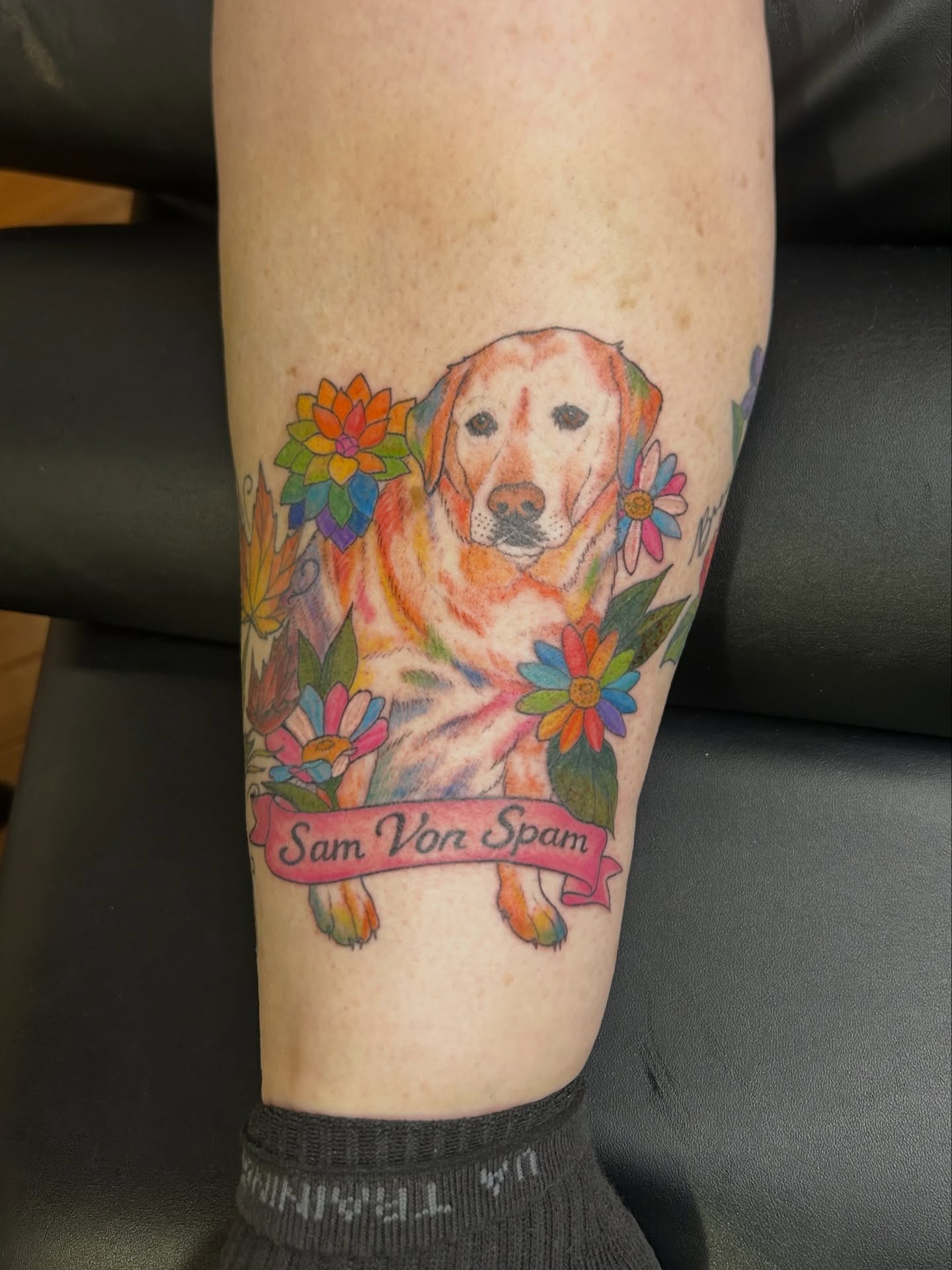 Dog portrait watercolor tattoo on the forearm by Kaylee