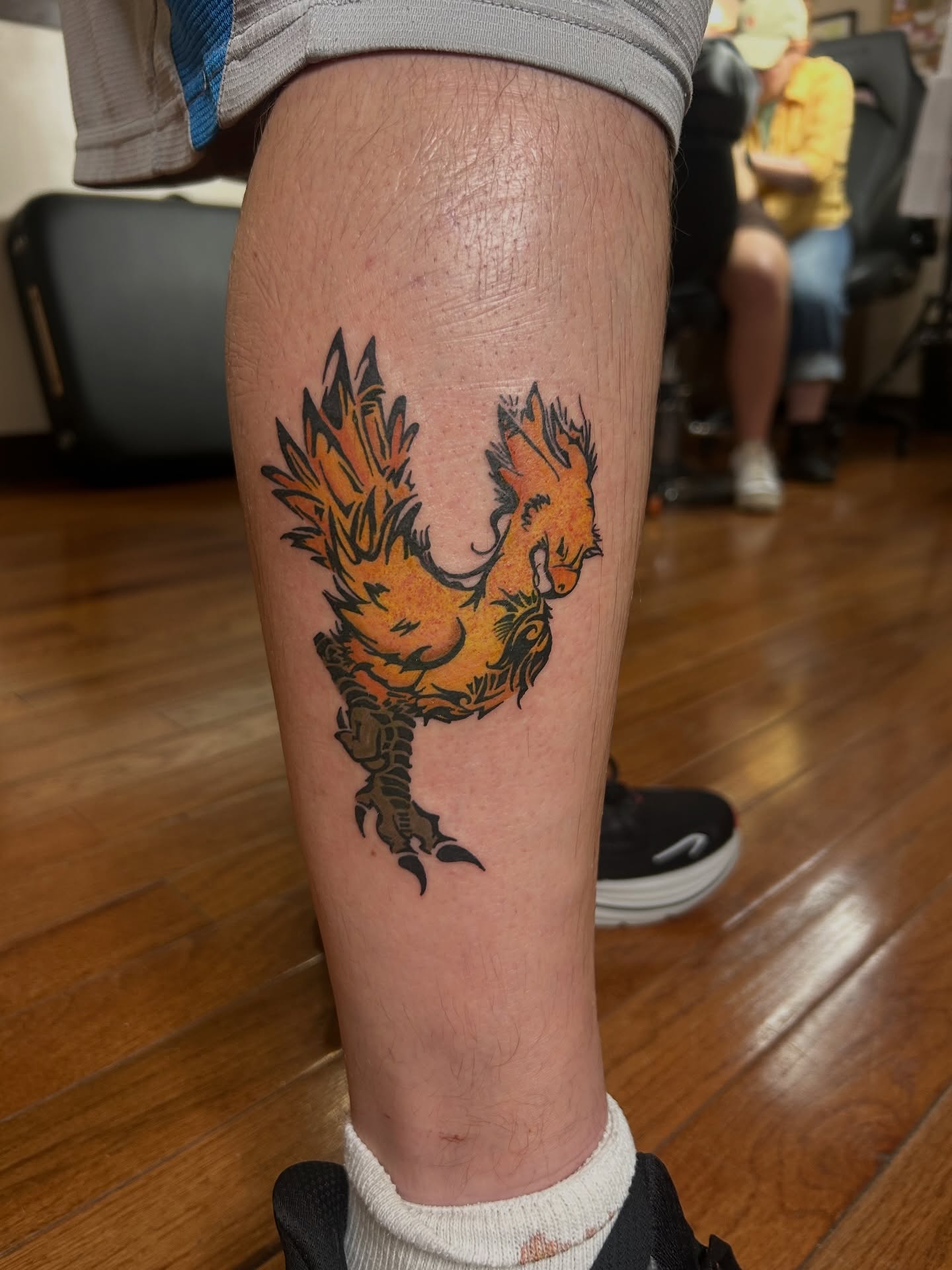 Phoenix American traditional tattoo on the calf by Kaylee