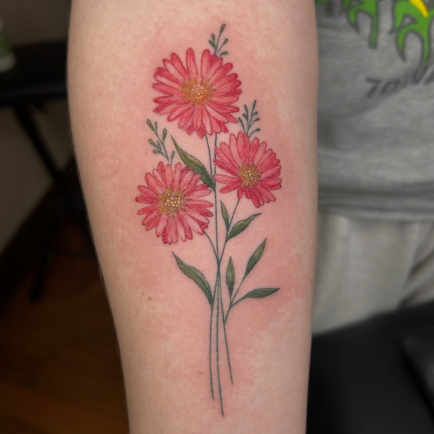 Daisies realism tattoo on the forearm by Kaylee