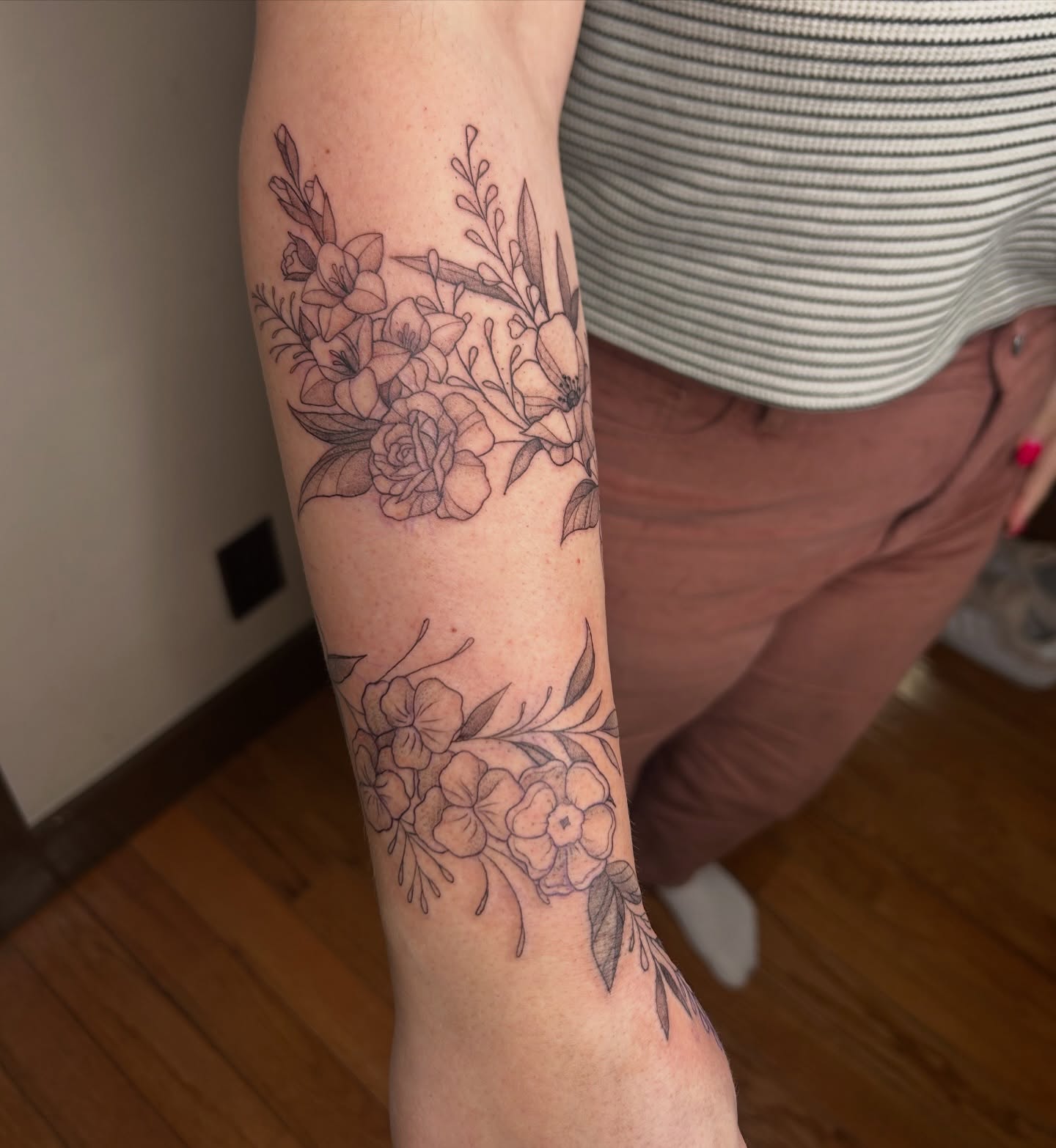 Floral bouquet black and grey tattoo on the forearm by Kaylee