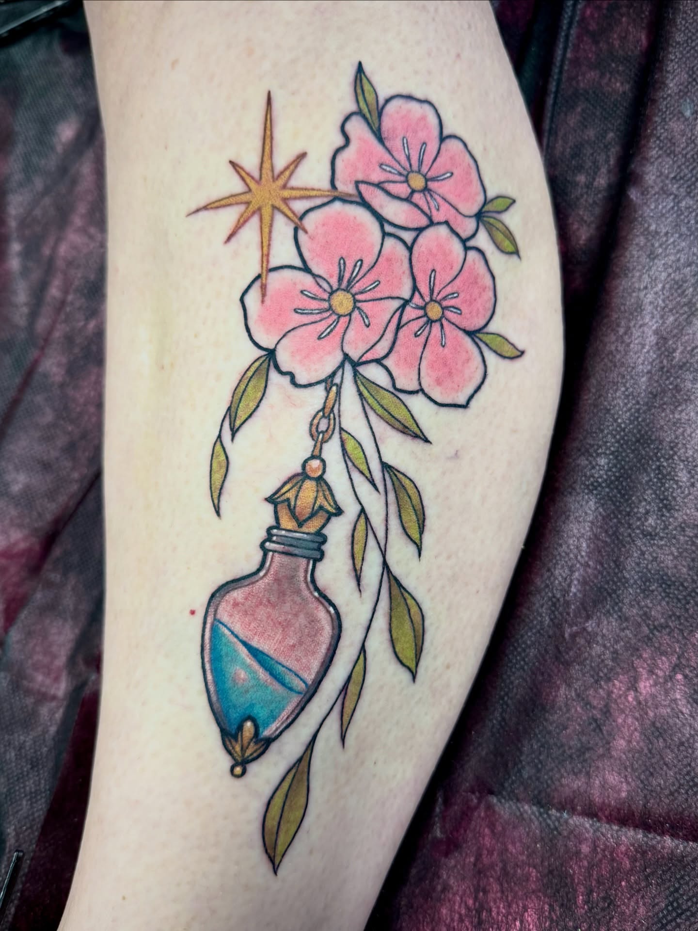 Flower arrangement with bottle new school tattoo on the forearm by Samantha Jane