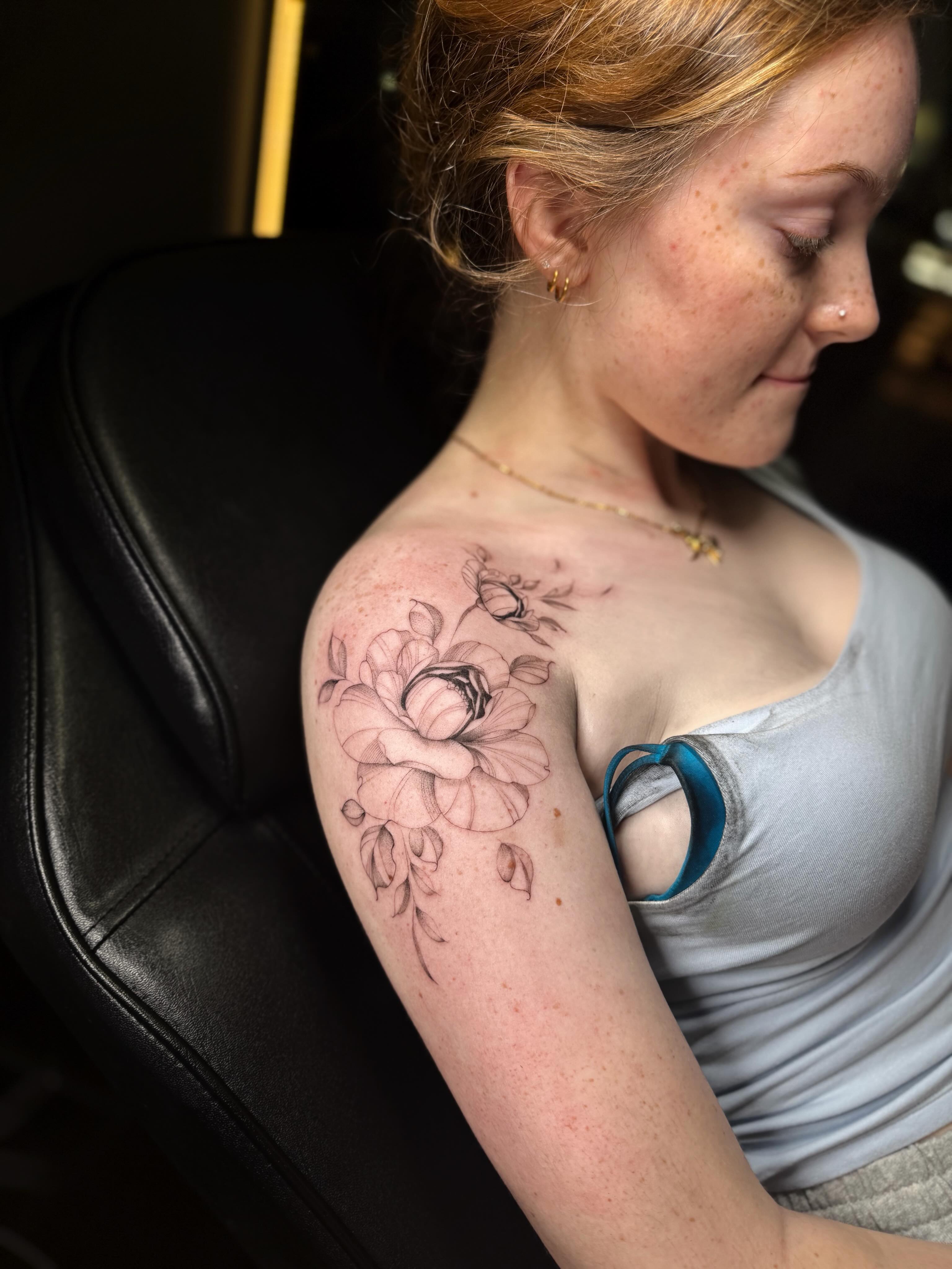 Floral arrangement black and grey tattoo on the shoulder by ꜰɪɴᴇ ʟɪɴᴇ ᴛᴀᴛᴛᴏᴏꜱ