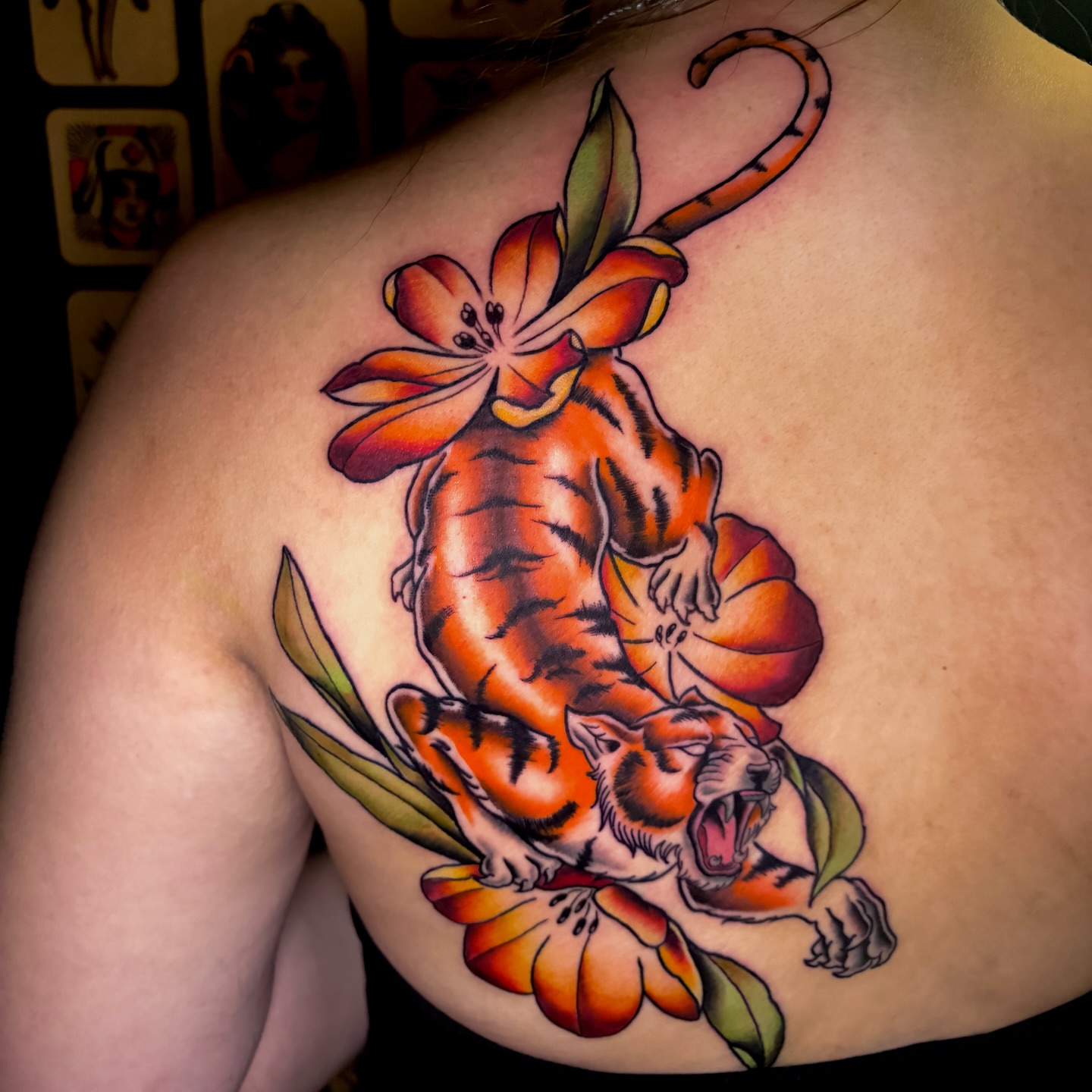 Tiger and lily American traditional tattoo on the back by Ashley Lin Las Vegas Tattoo Artist