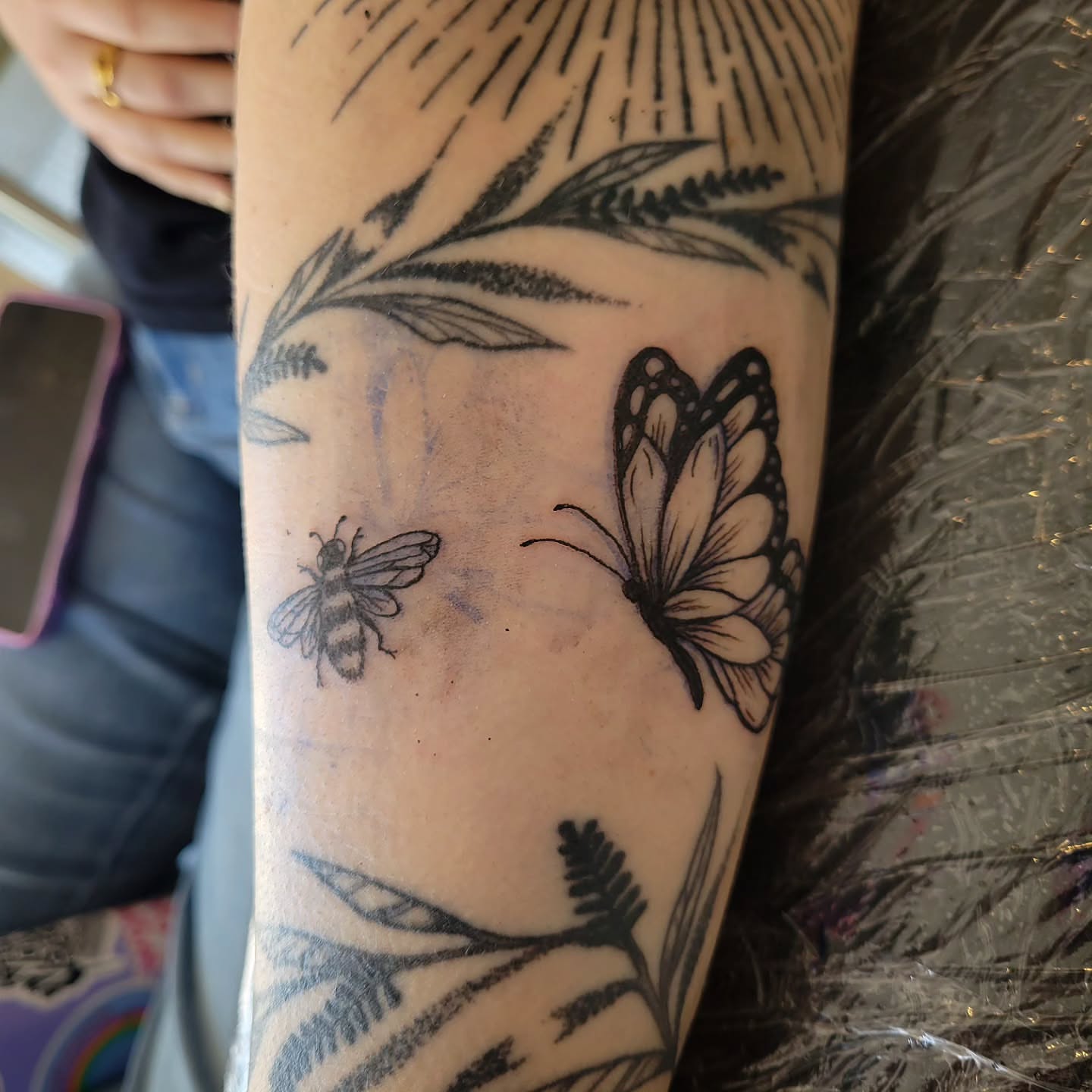 Butterfly and bee black and grey tattoo on the forearm by Solstice Tattoos by Savannah Sadler (future, Salisbury, North Carolina