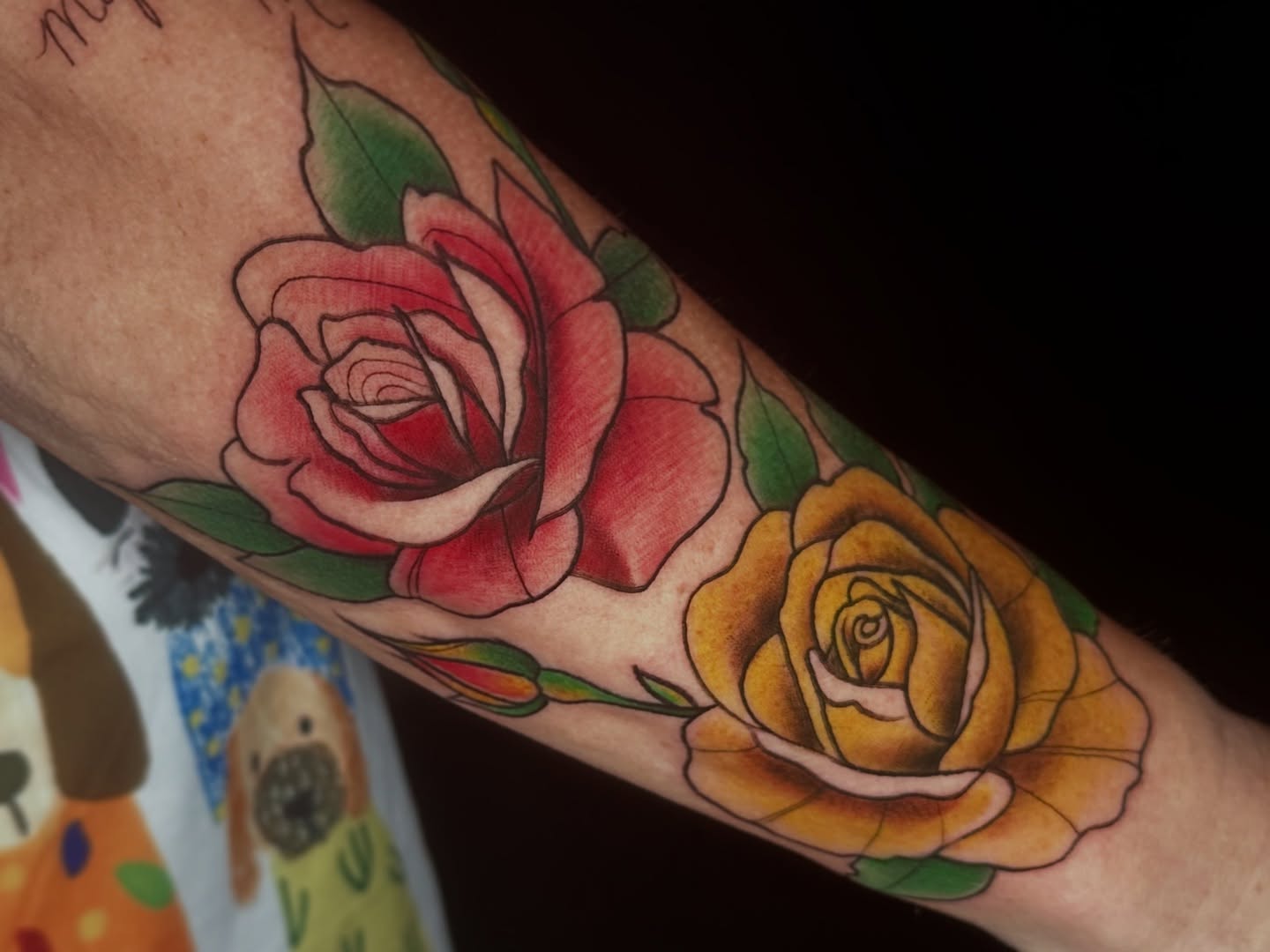 Roses American traditional tattoo on the forearm by Rachel Martinez