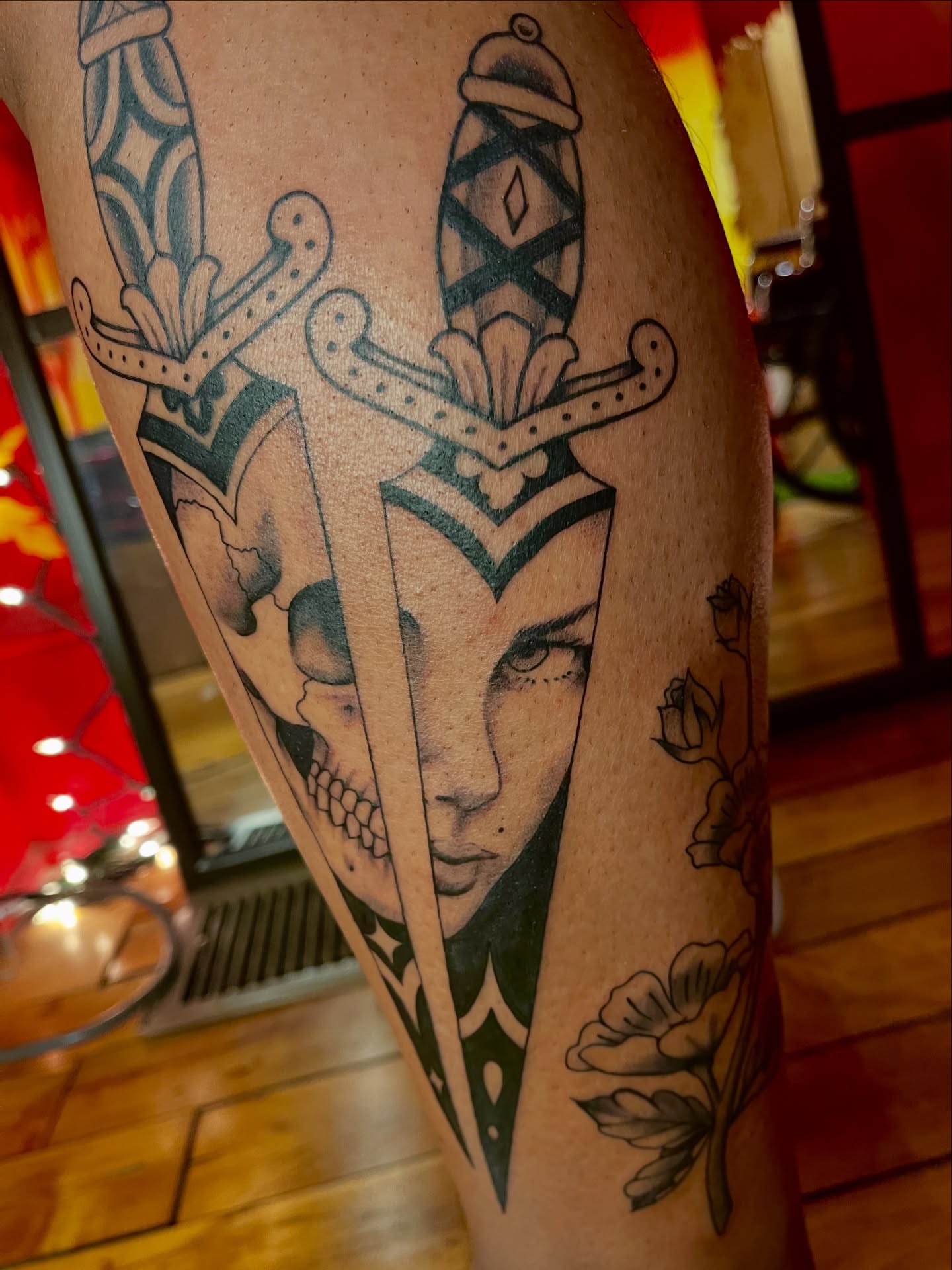 Woman's face with sword neo-traditional tattoo on the thigh by Zoe Phan, Richmond, Virginia