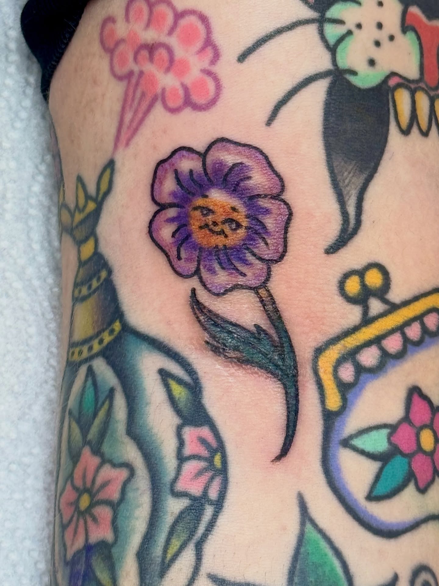 Flower American traditional tattoo on the forearm by Erica Mirella