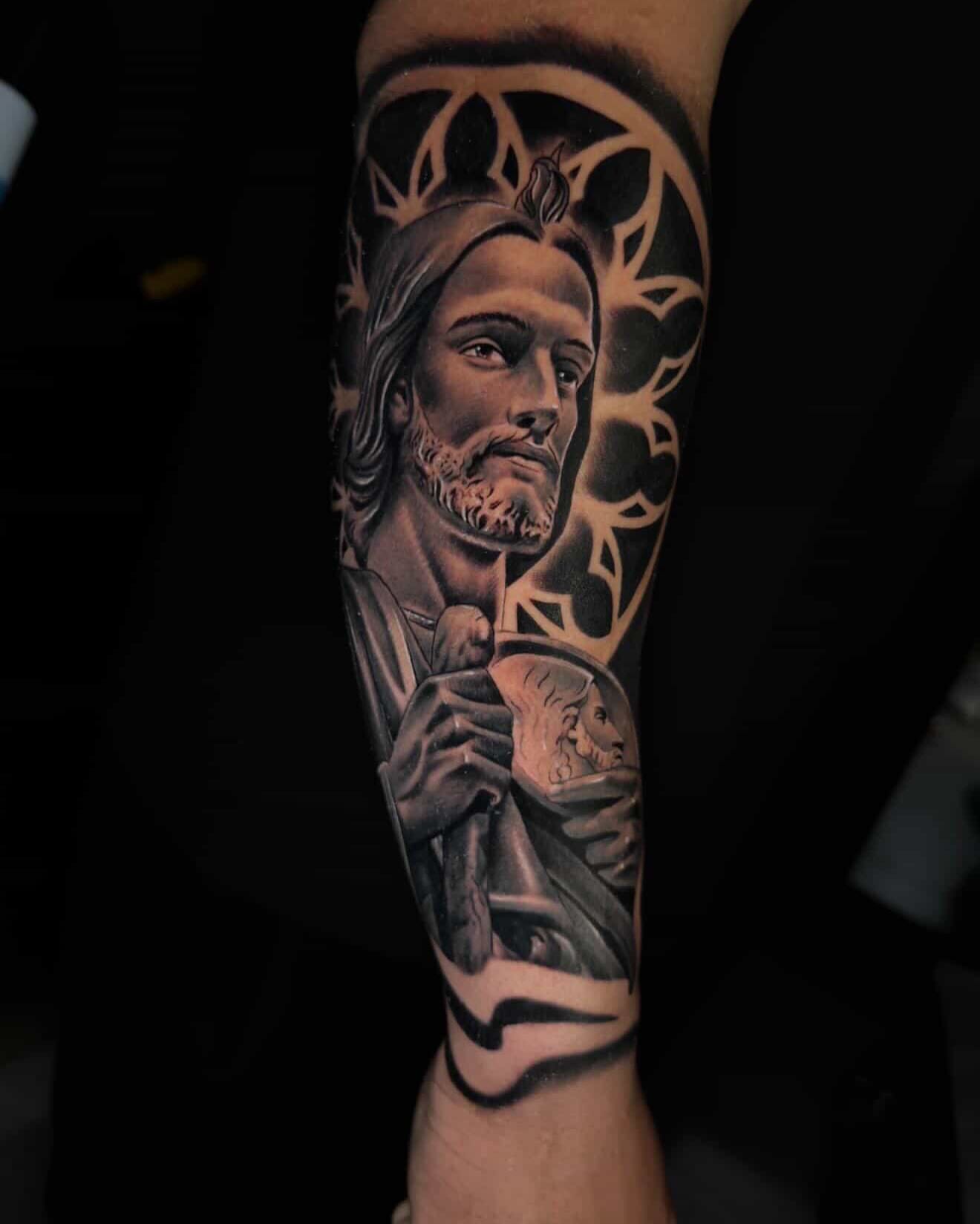 Religious figure realism tattoo on the forearm by Ayala Jose