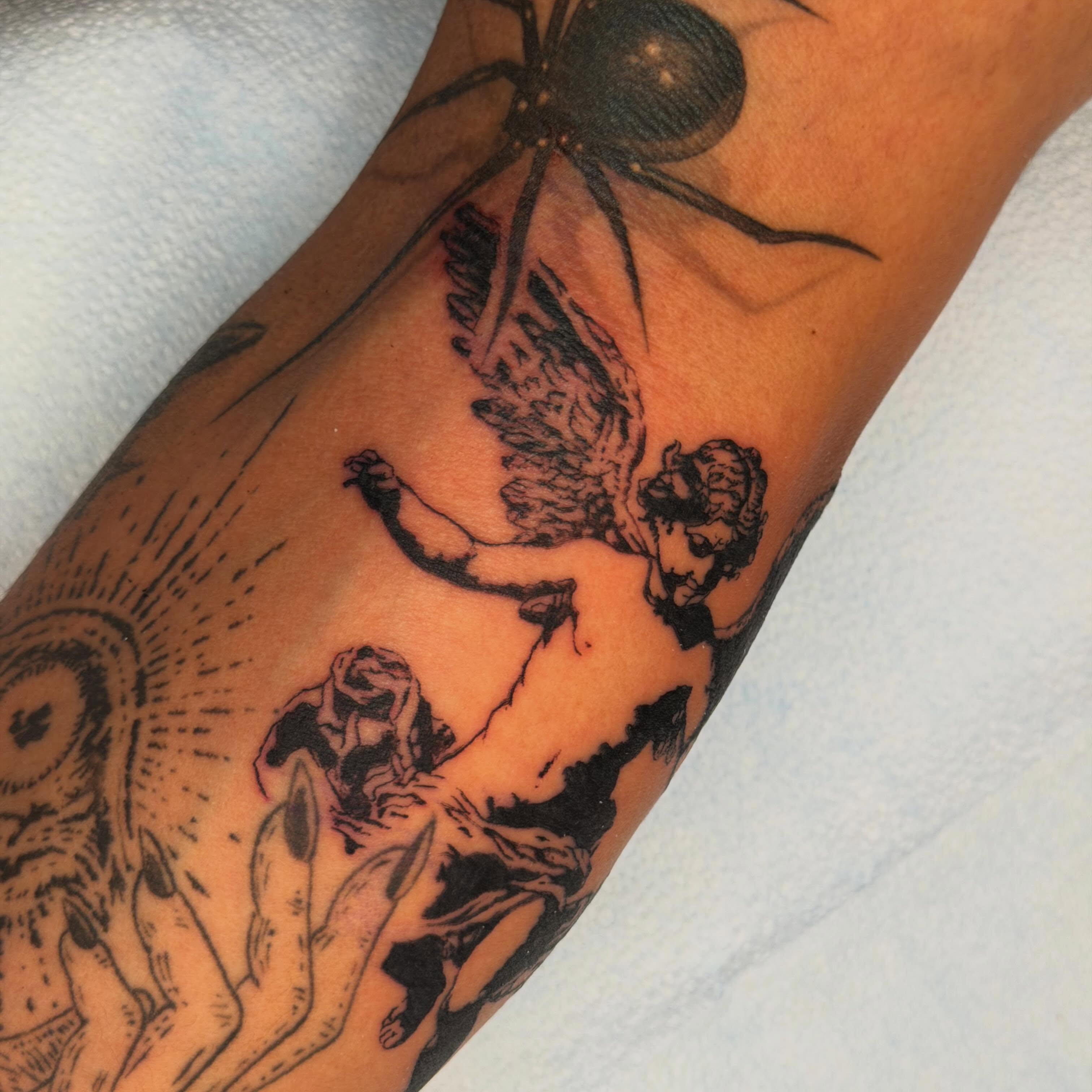 Angel and spider neo-traditional tattoo on the forearm by James Nelson
