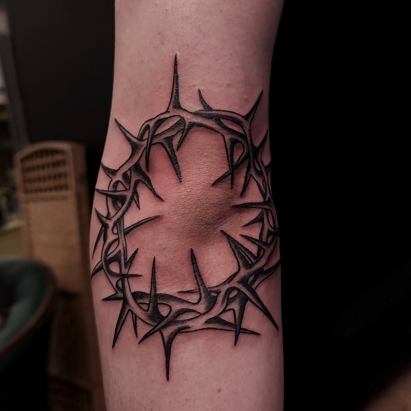 Crown of thorns black and grey tattoo on the forearm by xavia