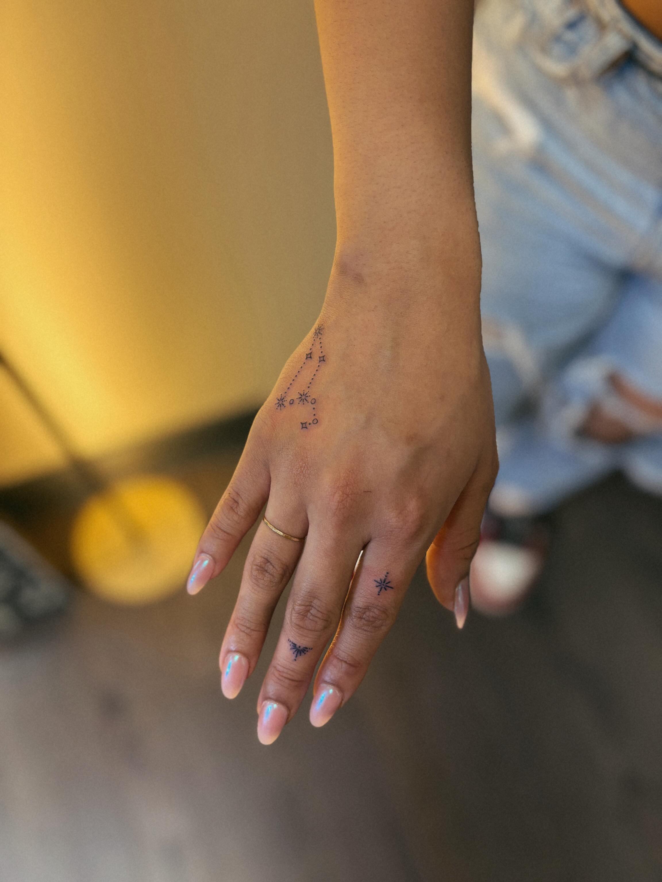 Constellation dotwork tattoo on the hand by Allie
