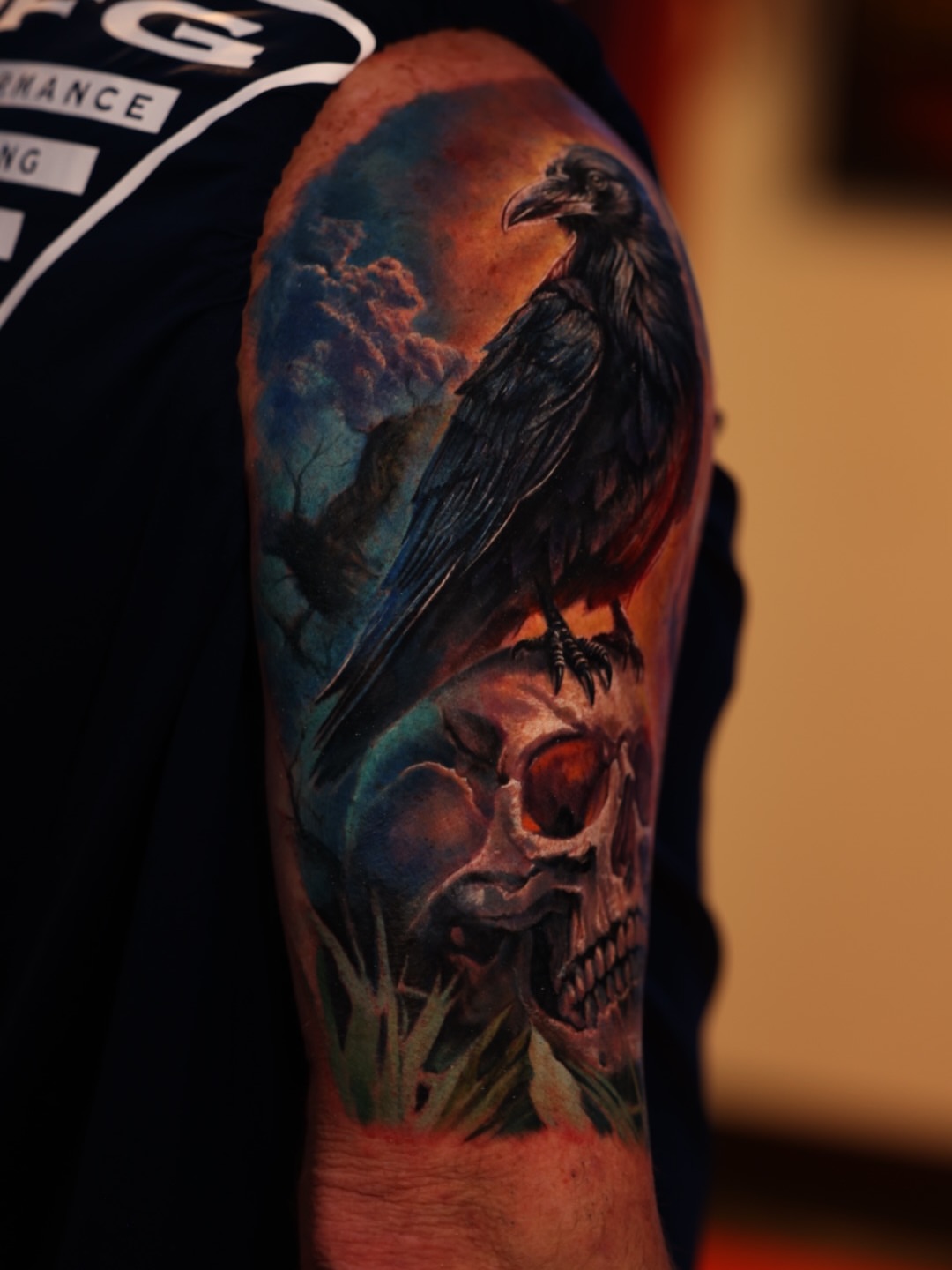 Crow and skull realism tattoo on the forearm by Brandon Sontag