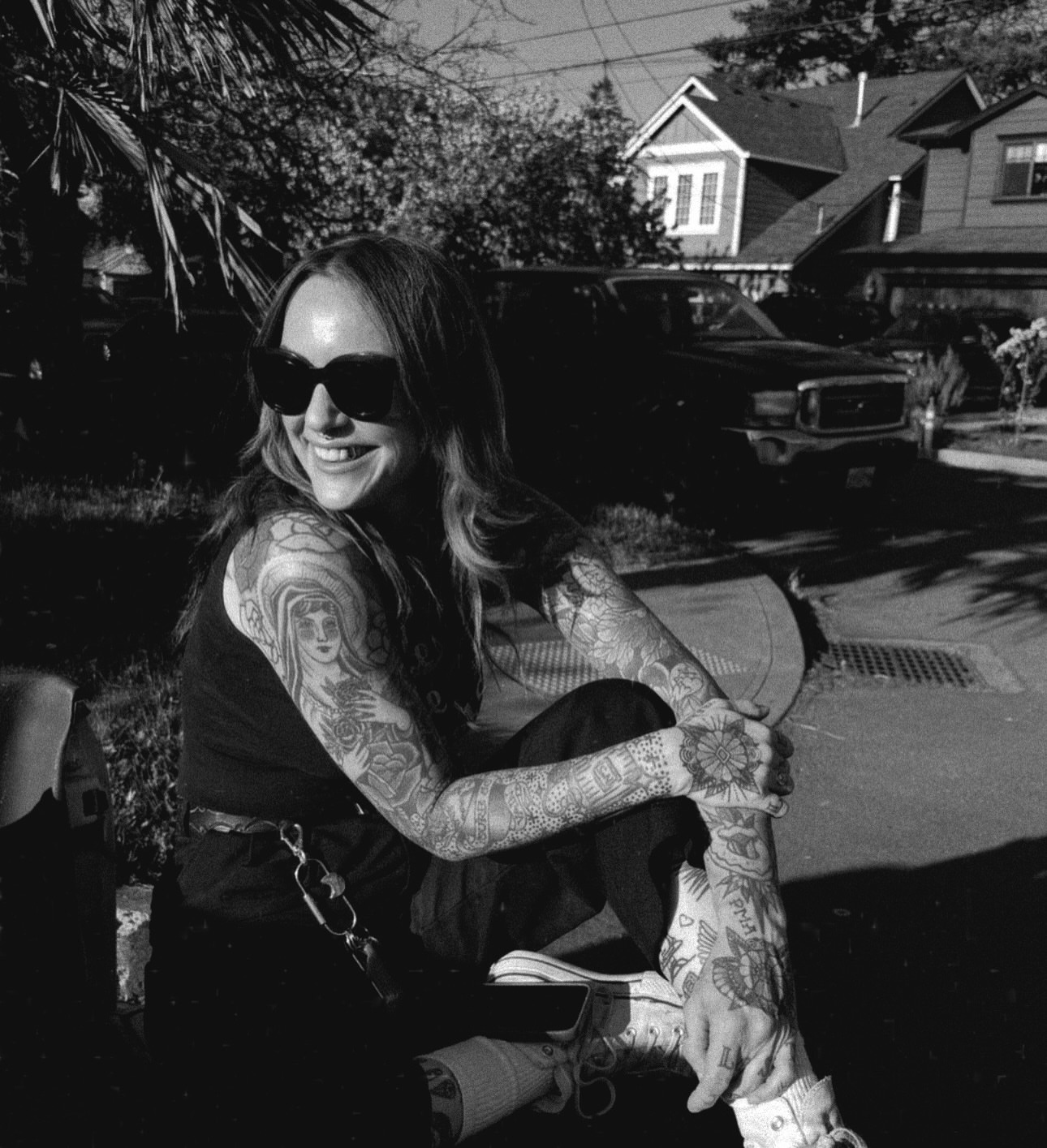 Full arm sleeve black and grey tattoo on the upper arm by Madeline Seeley