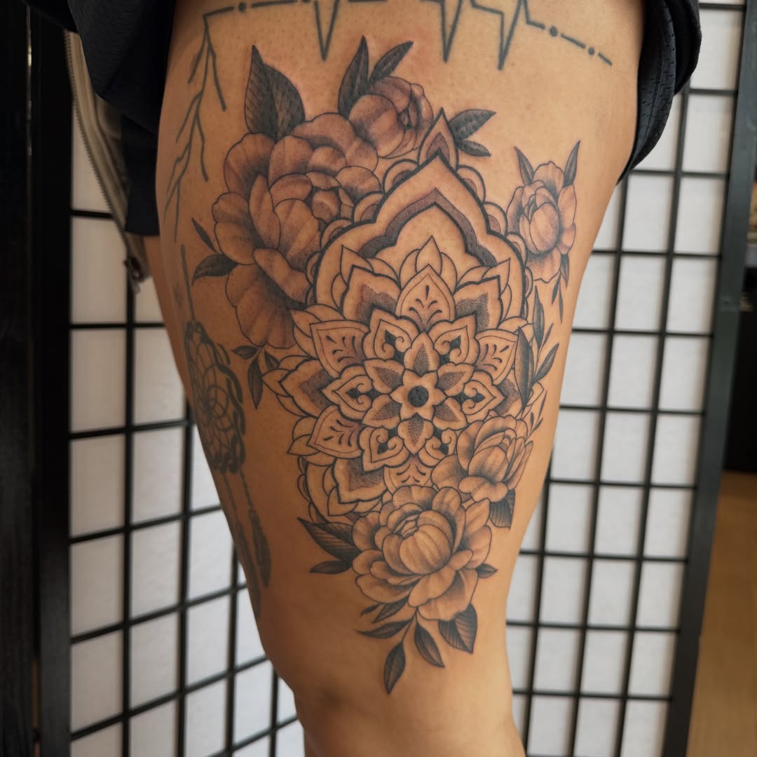 Floral mandala ornamental tattoo on the thigh by Kaley, Des Moines, Iowa
