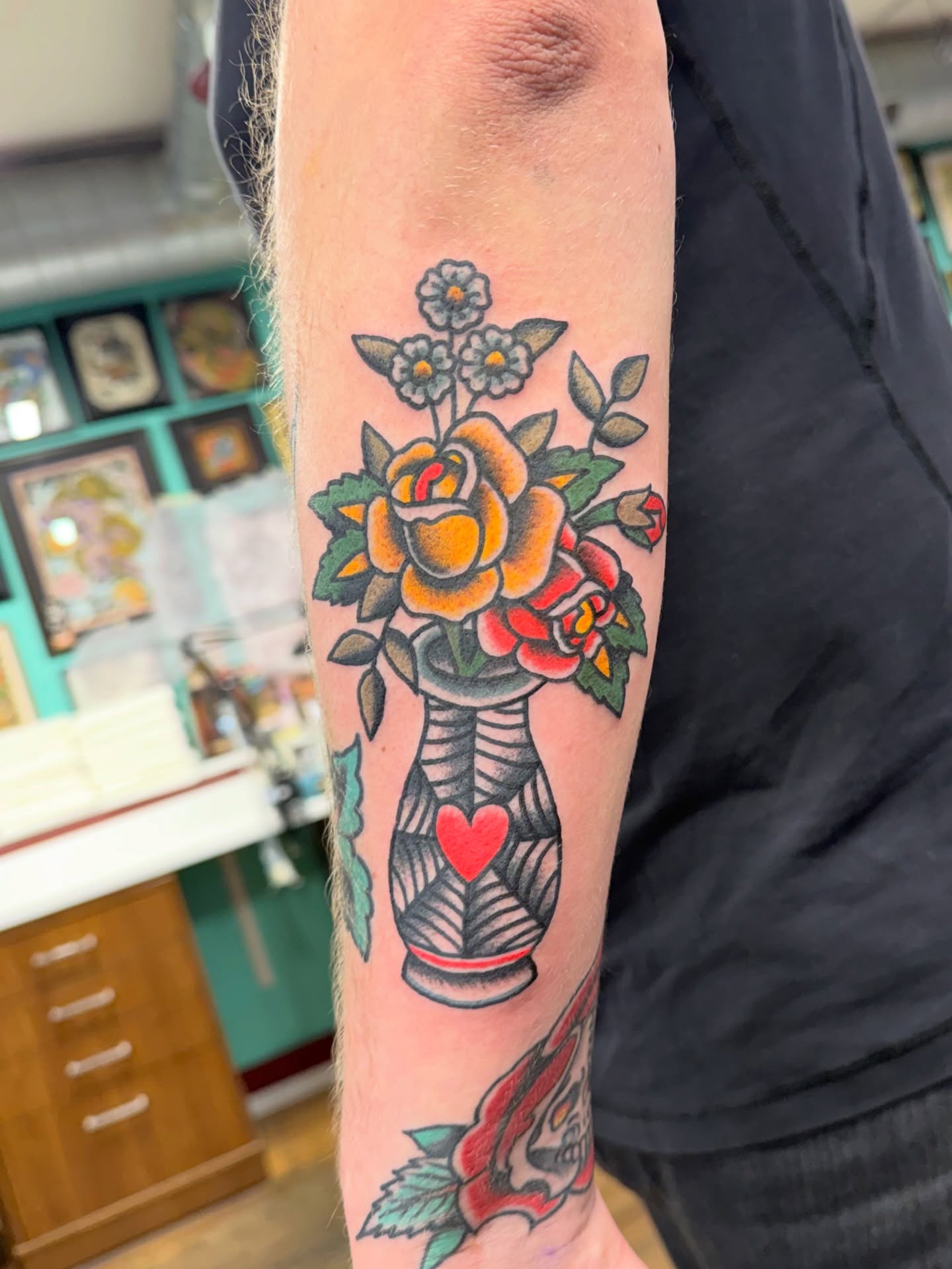 Flower bouquet American traditional tattoo on the forearm by Aaron ulfstam