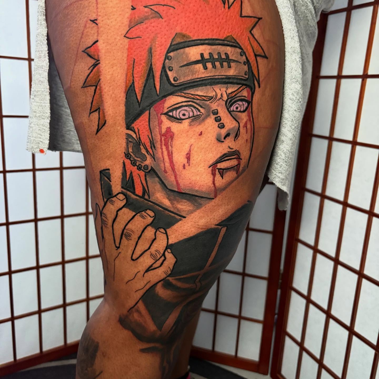 Naruto anime tattoo on the thigh by D. Davis