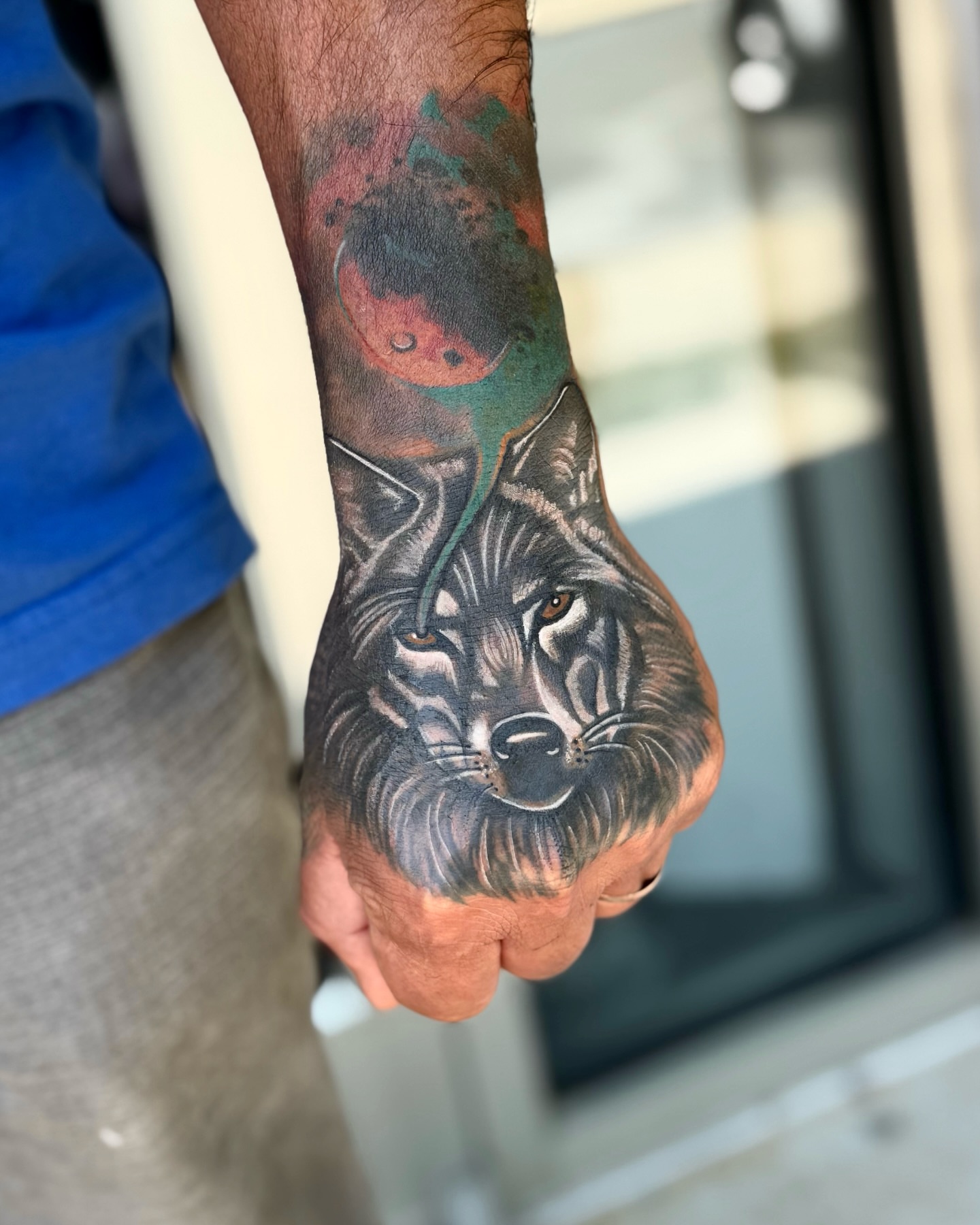 Wolf realism tattoo on the hand by Emily Velletta, Huntersville, North Carolina