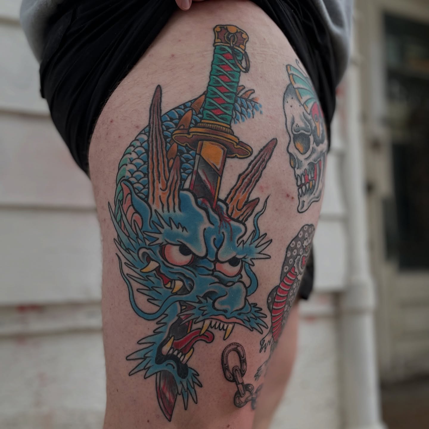 Dragon and sword American traditional tattoo on the thigh by Mike Maciejewski:Chicago Tattoo Artist