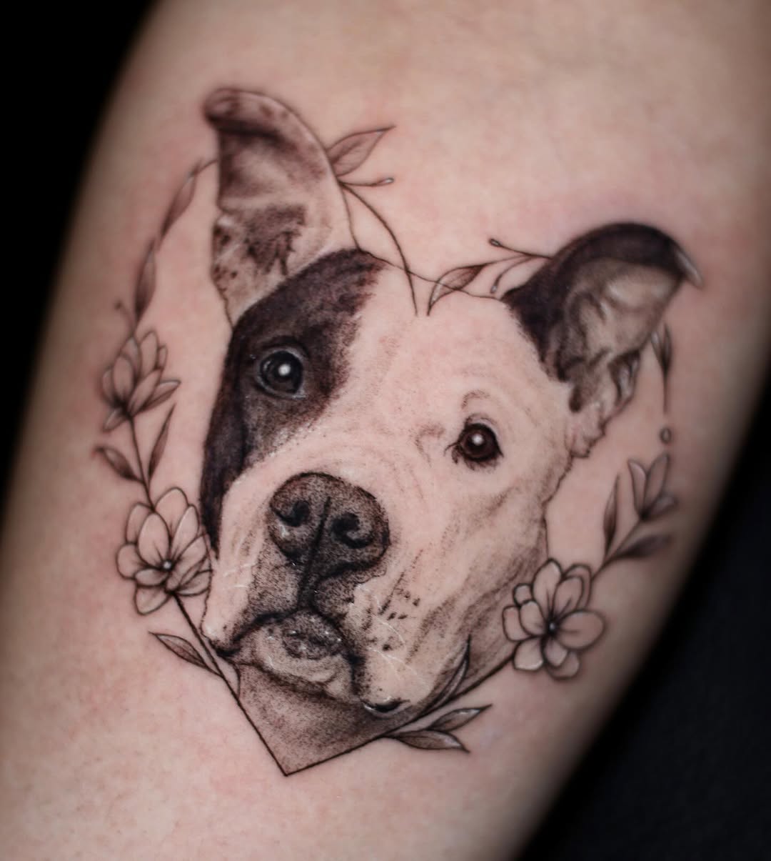 Pitbull portrait with flowers realism tattoo on the forearm by 𝐒𝐡𝐞𝐫𝐥𝐥𝐲