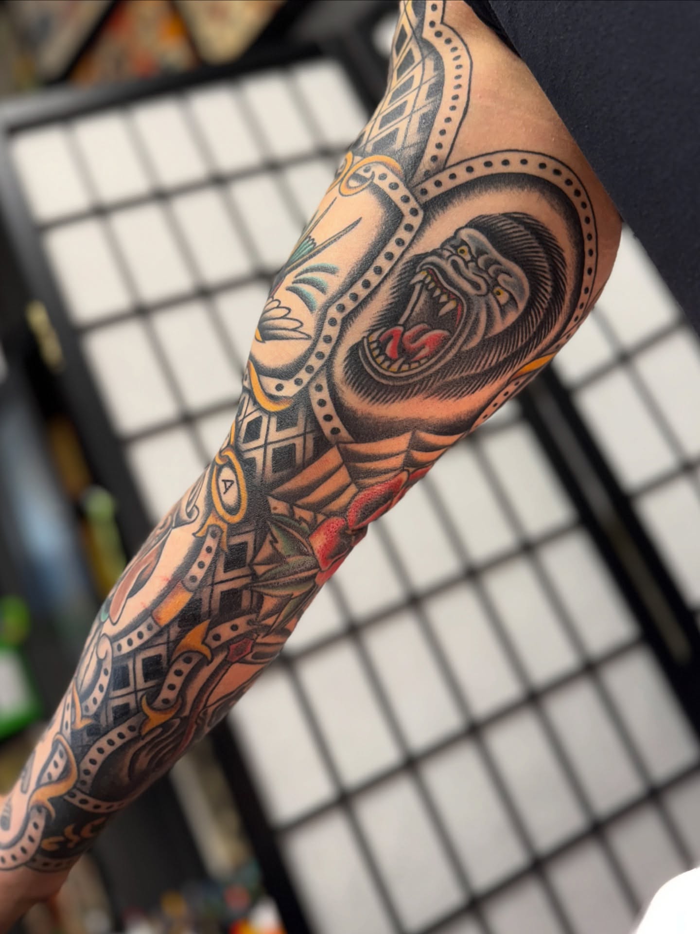Mask and dragon American traditional tattoo on the forearm by Sarah Pham