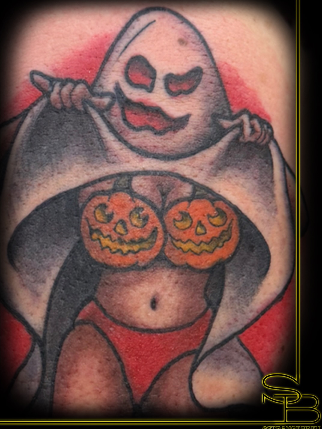 Ghost with pumpkin breasts American traditional tattoo on the torso by Chris Breuer, Asbury Park, New Jersey