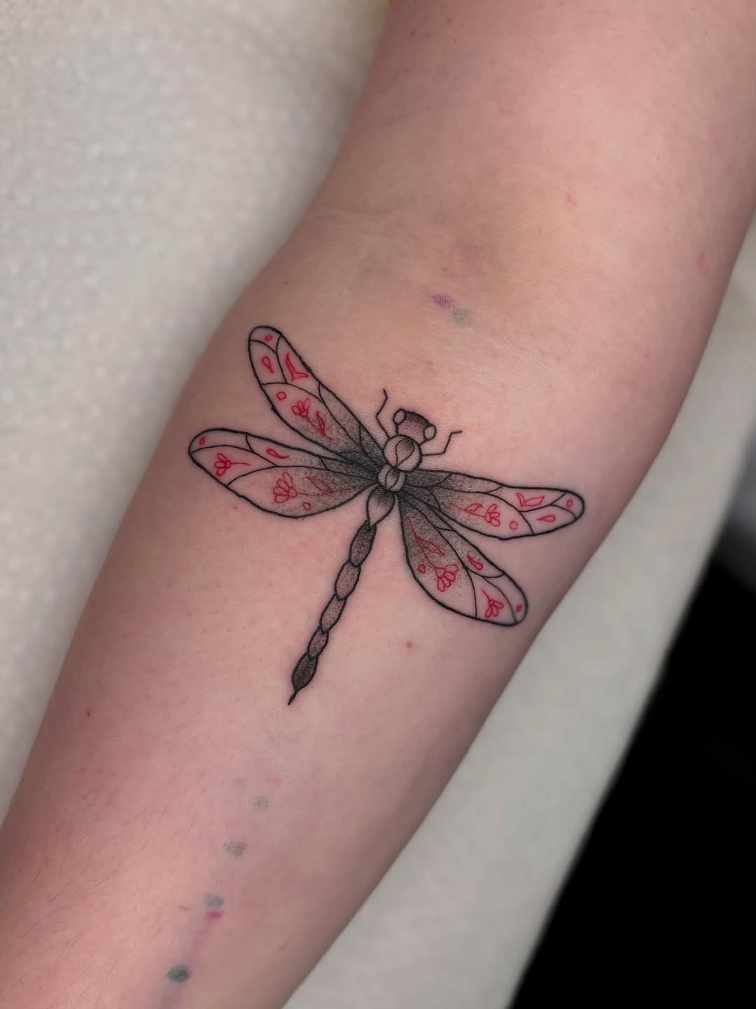 Dragonfly with floral patterns fine line tattoo on the forearm by ππ‘ππ―π² πππ₯π₯ππ²