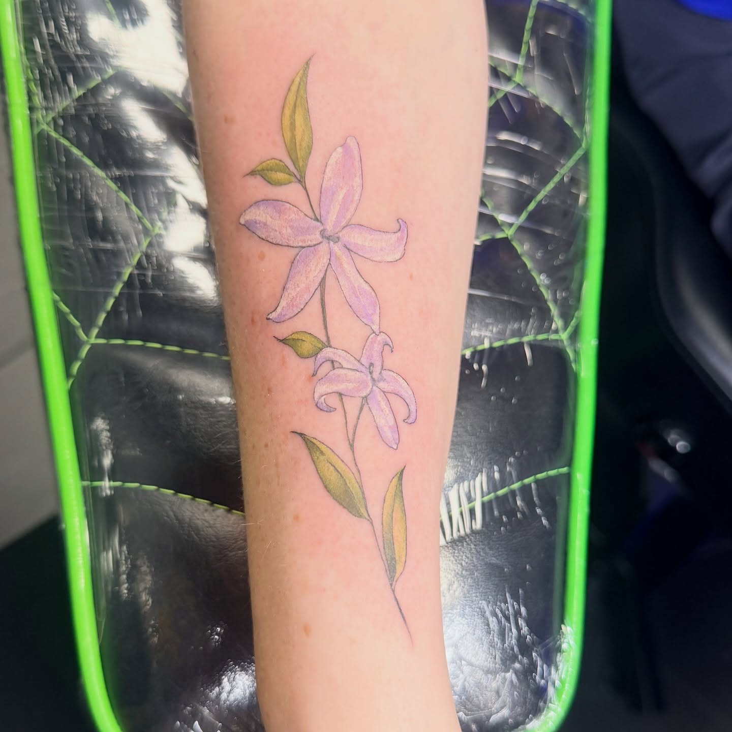 Flowers realism tattoo on the forearm by Stephanie Comito-Stephens