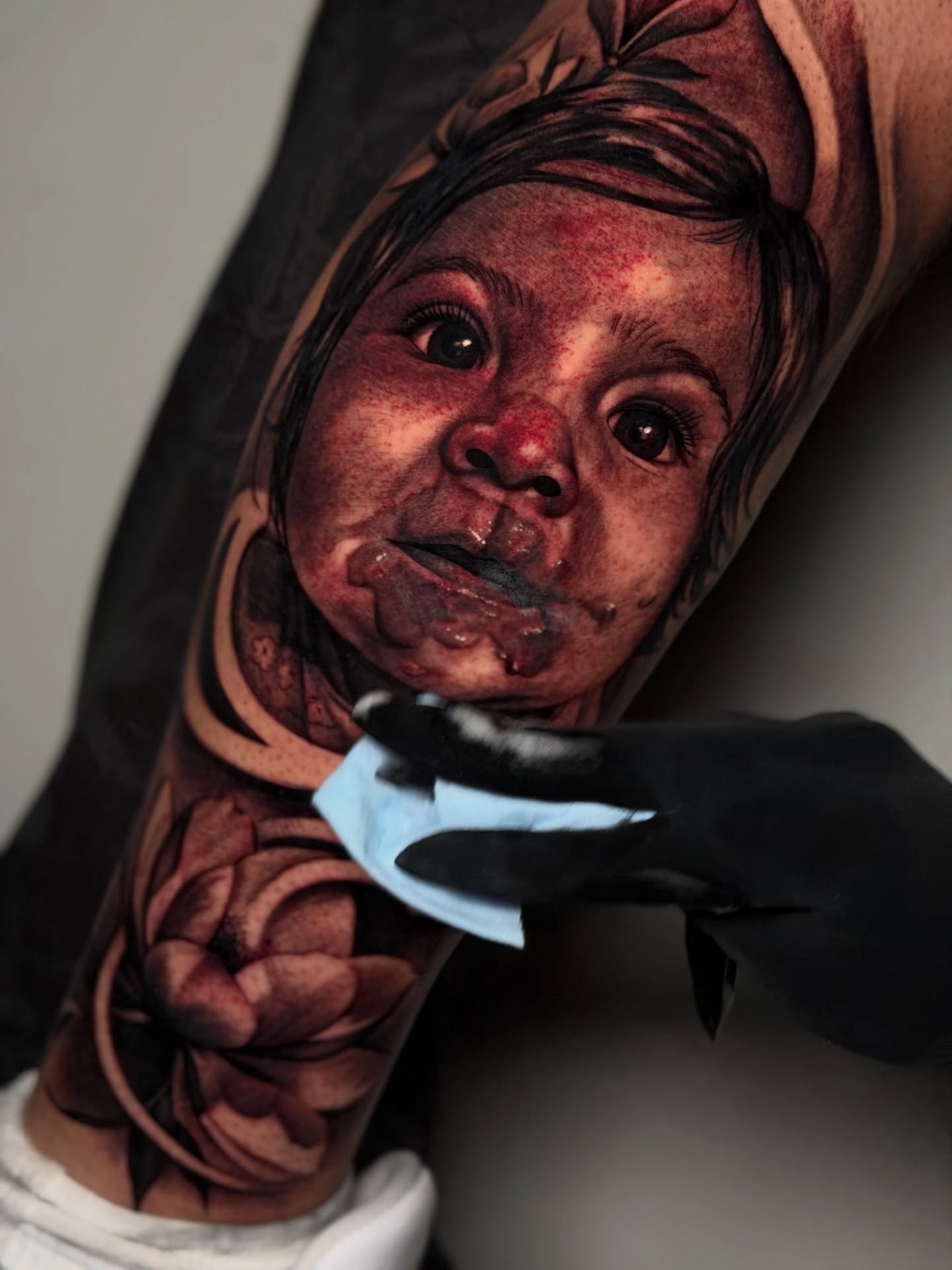Child realism tattoo on the forearm by Kiki Tattoos😈