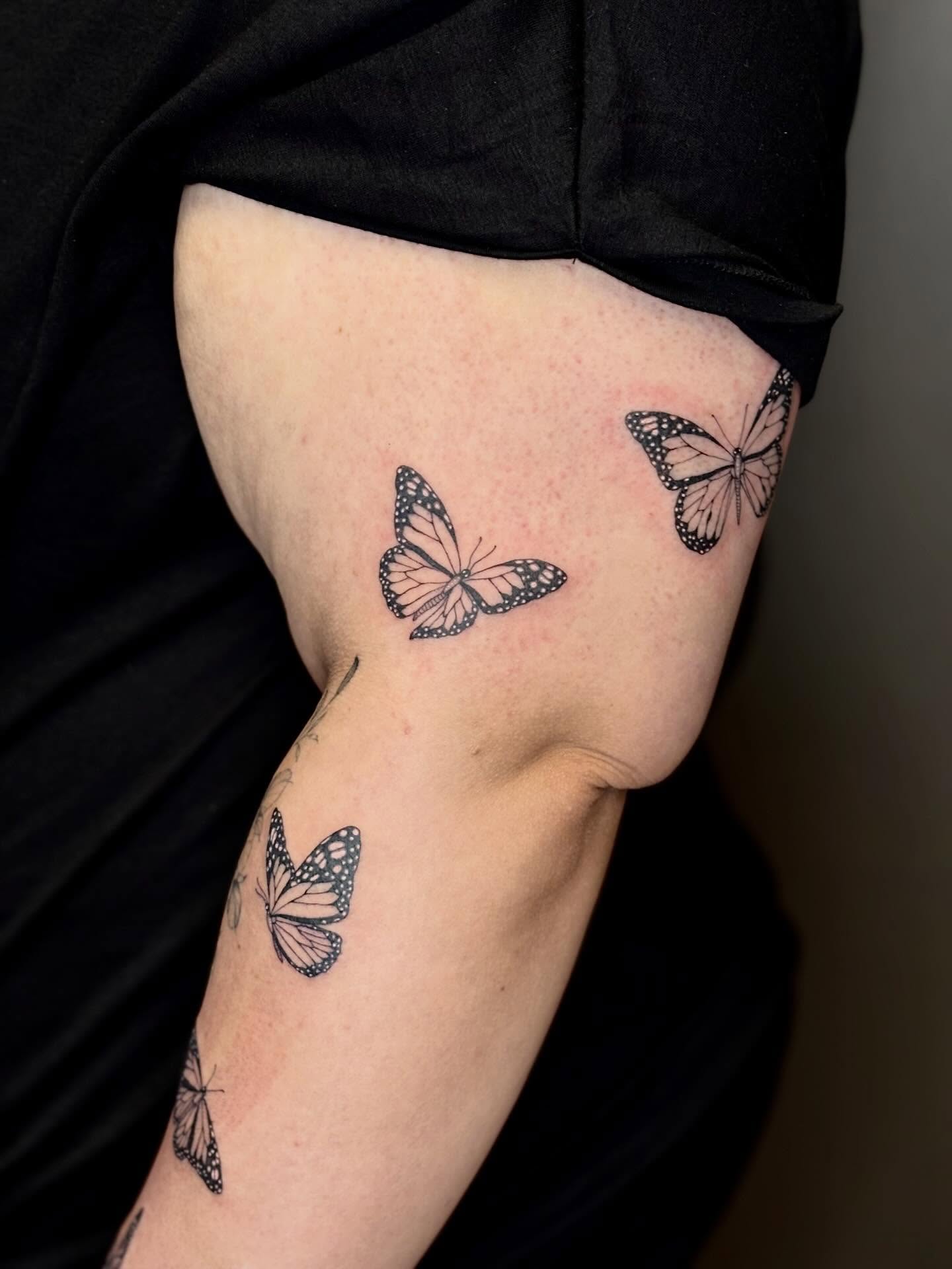 Butterflies black and grey tattoo on the upper arm by 🖤Sidney🖤