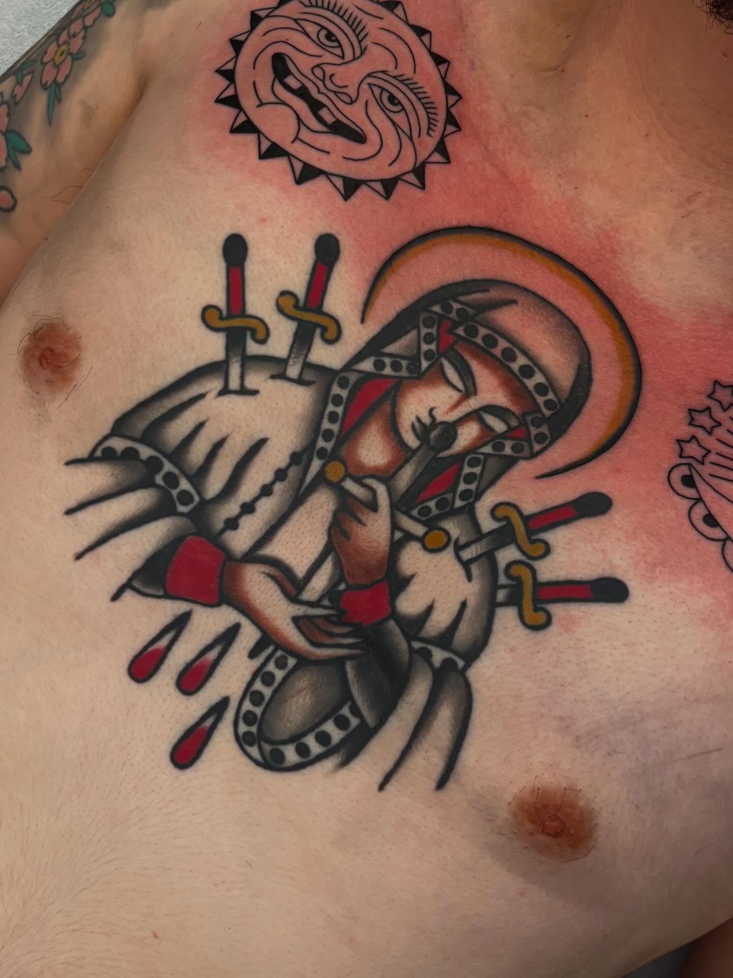 Demon with swords American traditional tattoo on the chest by Claire Anderson