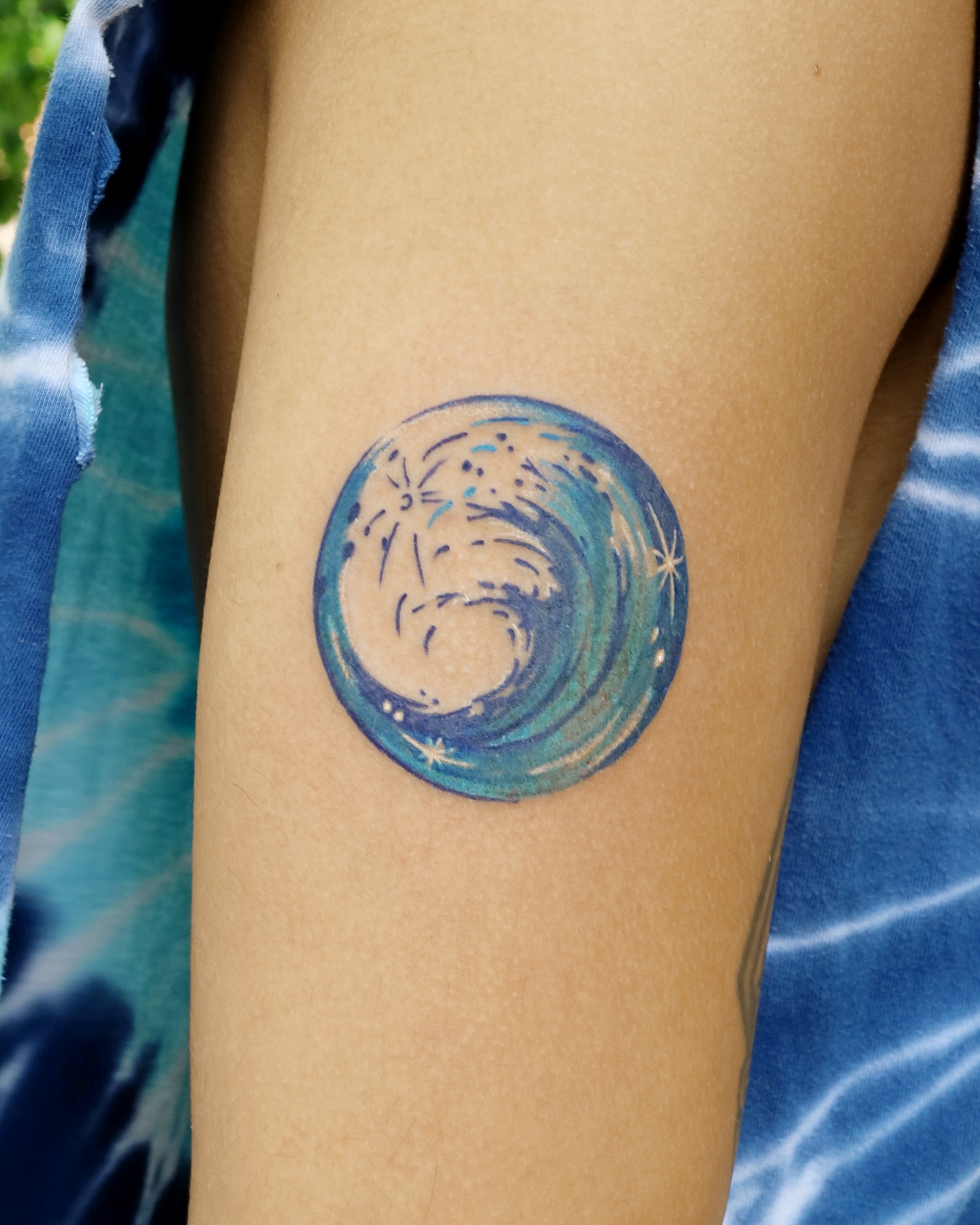 Wave watercolor tattoo on the forearm by Aroha