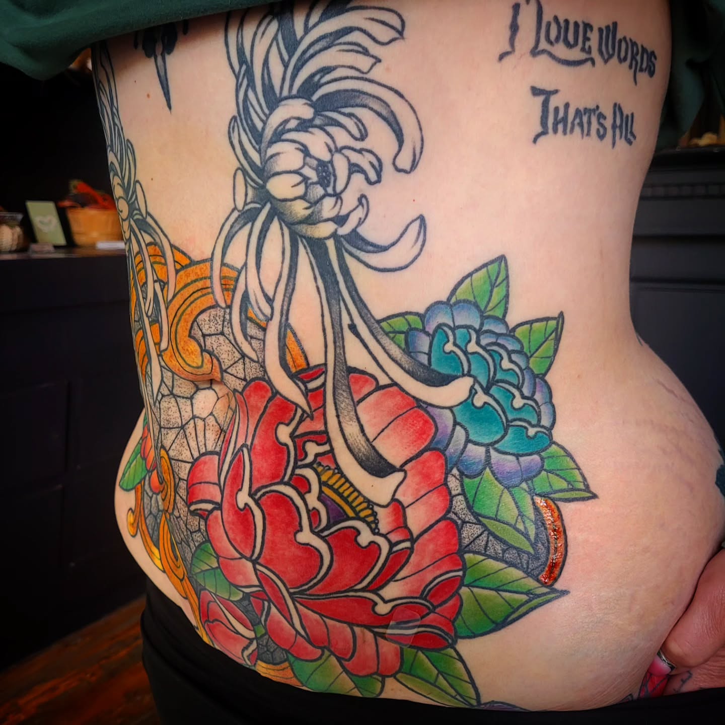 Peony and dragon American traditional tattoo on the ribs by Ashley Thomas, Midvale, Utah