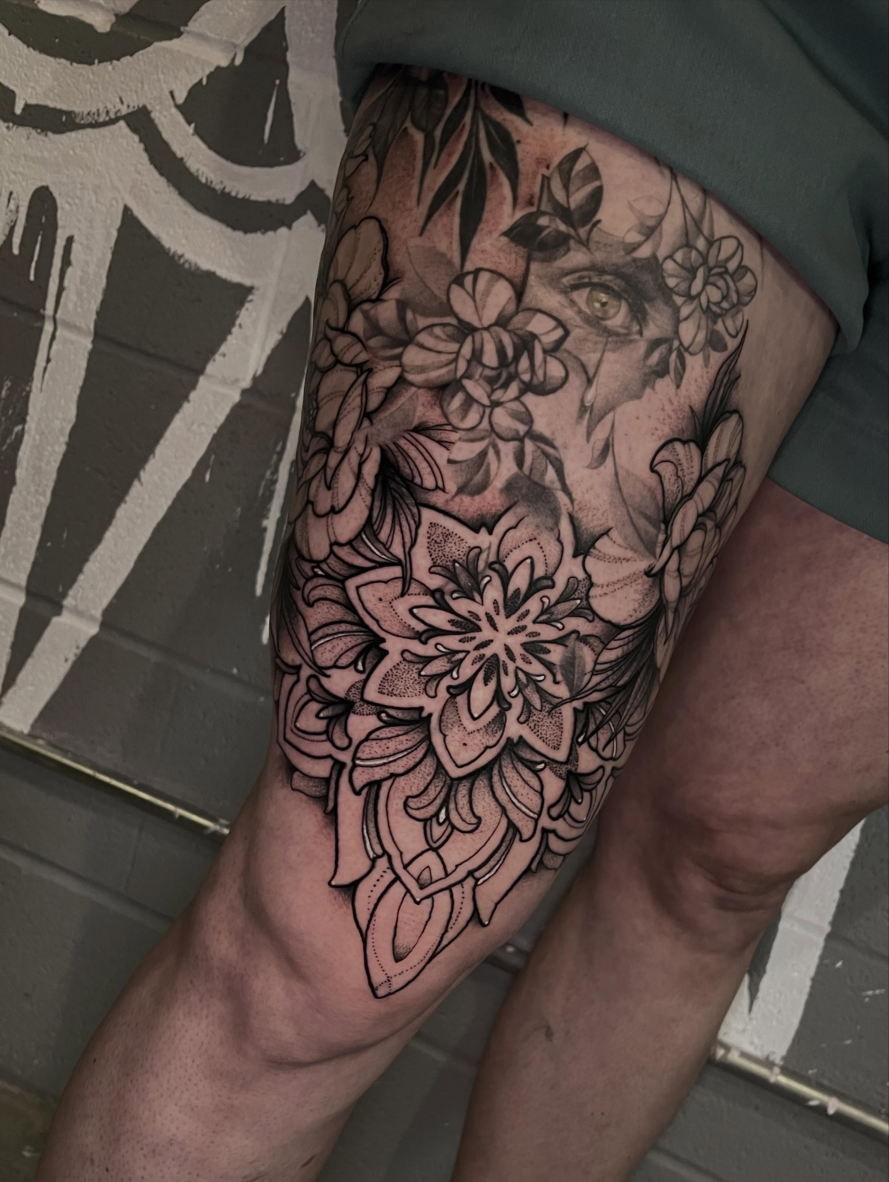 Floral arrangement black and grey tattoo on the thigh by Brandon Mola, Chicago, Illinois