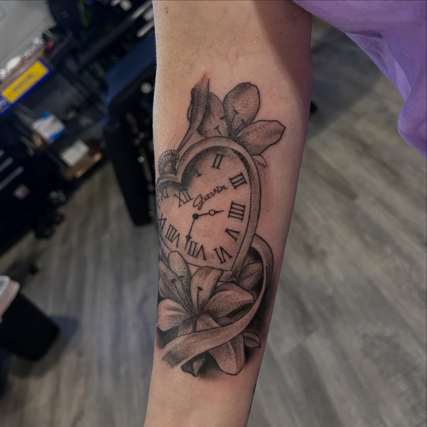 Clock with floral elements dotwork tattoo on the forearm by Oto_art