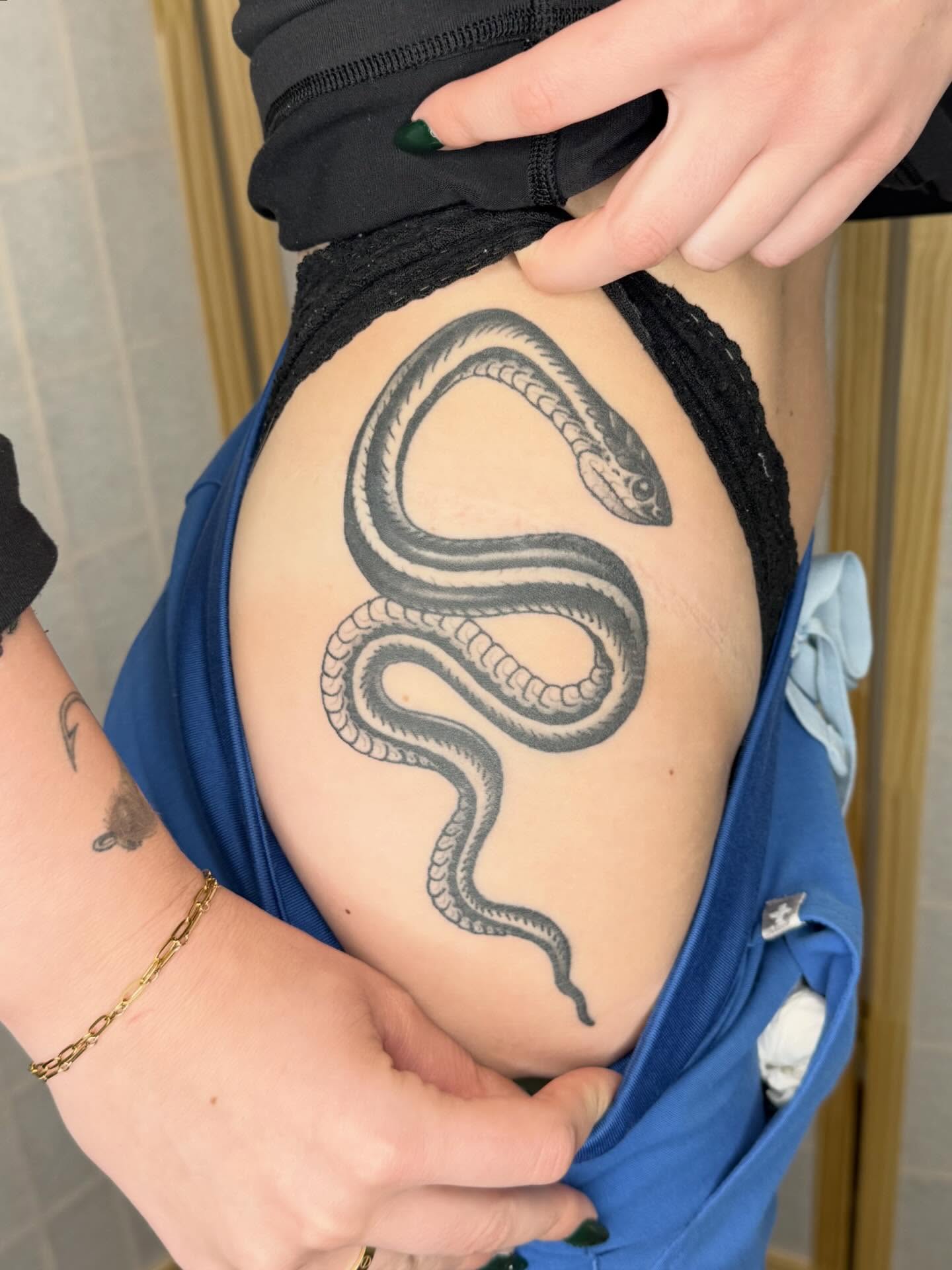 Snake black and grey tattoo on the thigh by Matt Paw