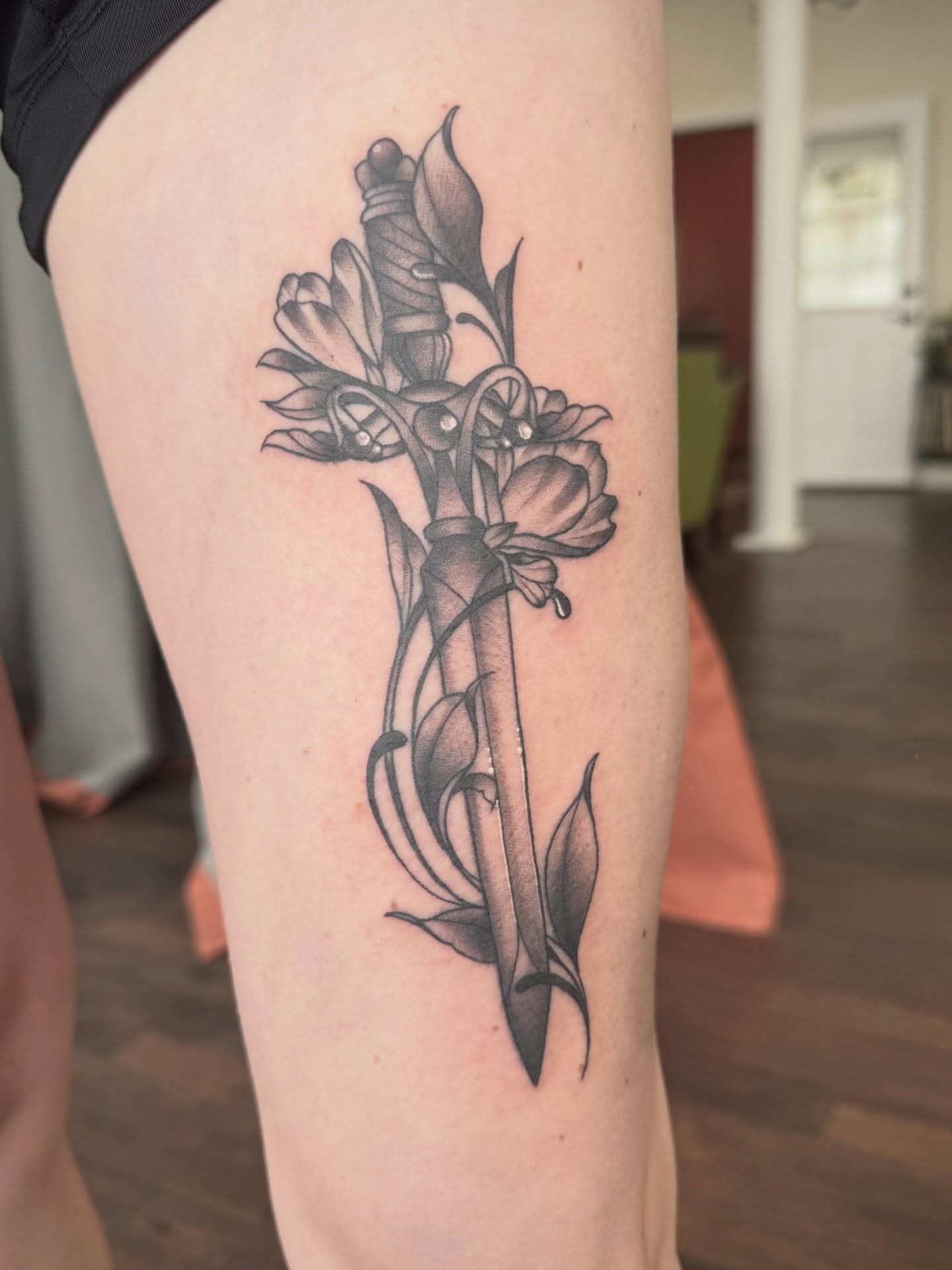 Sword and flowers realism tattoo on the thigh by Alisa (Li) Affatato ๐ผ
