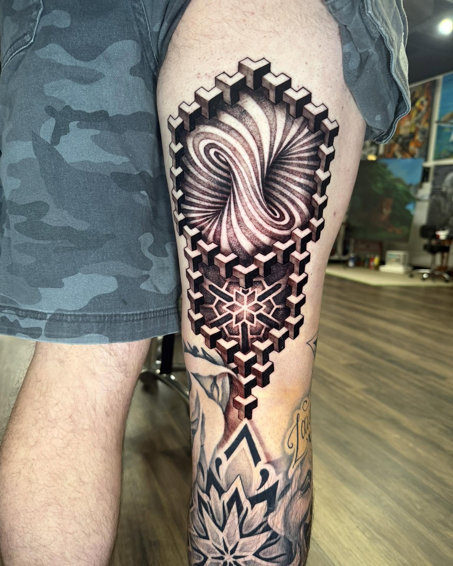 Geometric spiral geometric tattoo on the forearm by Chad Meado