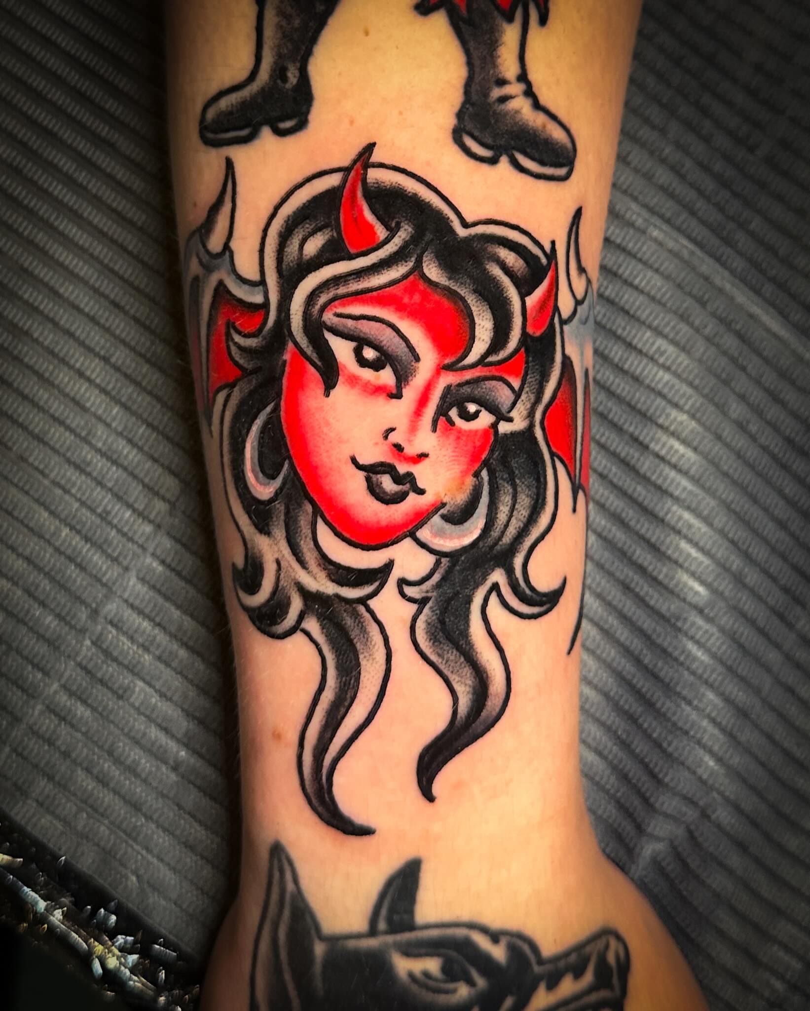 Devil girl American traditional tattoo on the forearm by Stacey Colangelo